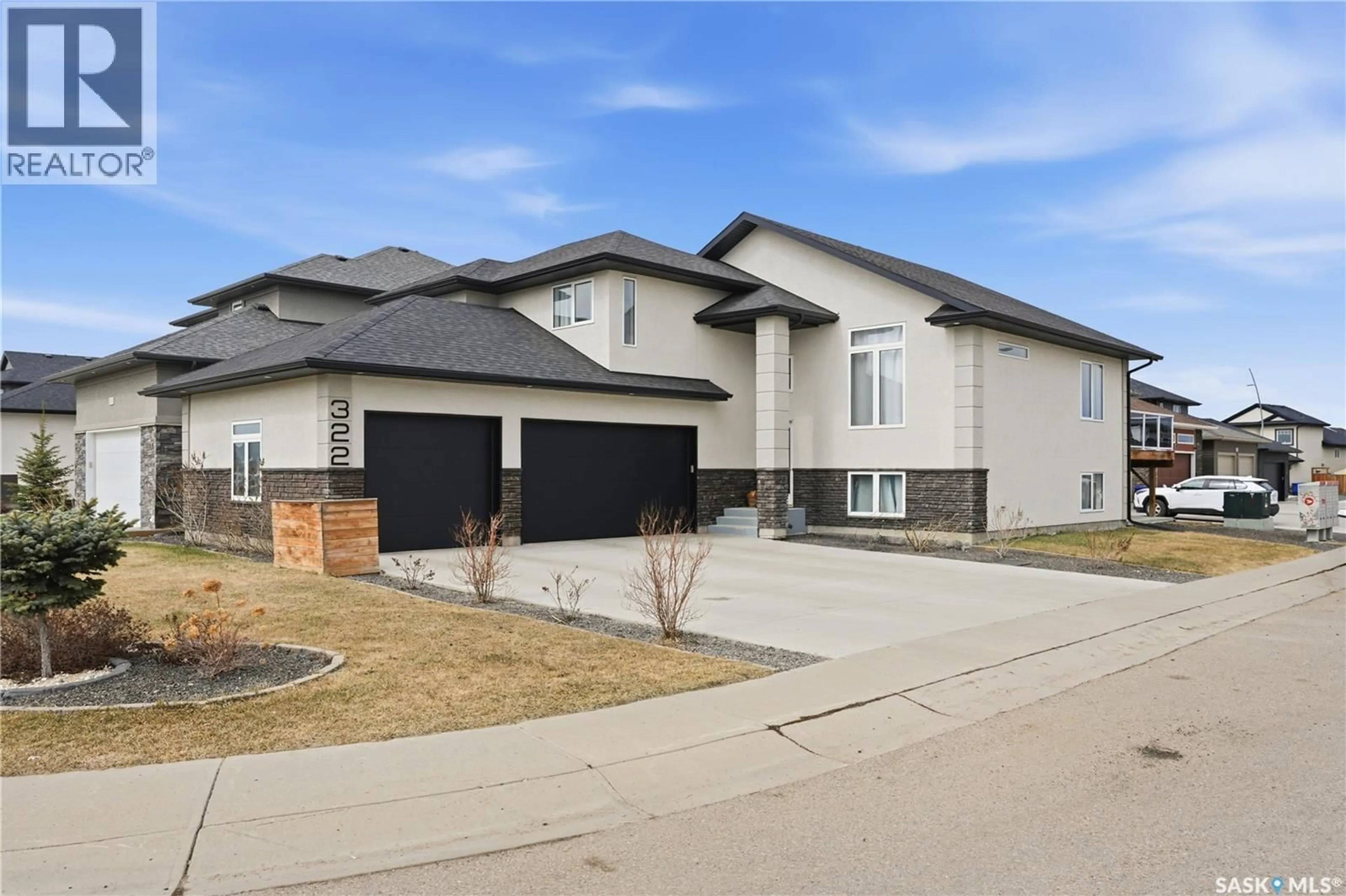 Home with brick exterior material, street for 322 GLACIAL SHORES MANOR, Saskatoon Saskatchewan S7S1N1
