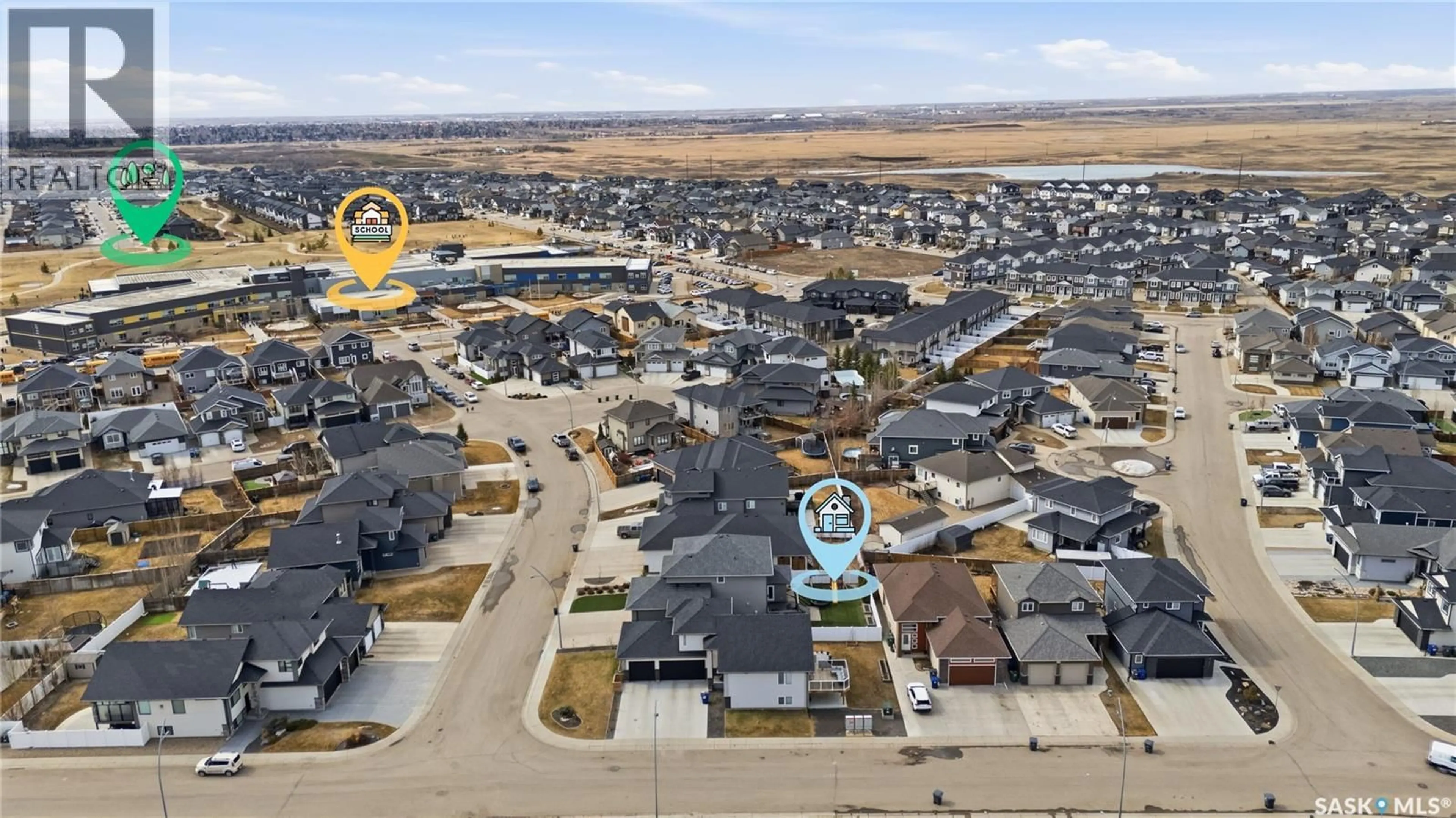 A pic from outside/outdoor area/front of a property/back of a property/a pic from drone, water/lake/river/ocean view for 322 GLACIAL SHORES MANOR, Saskatoon Saskatchewan S7S1N1