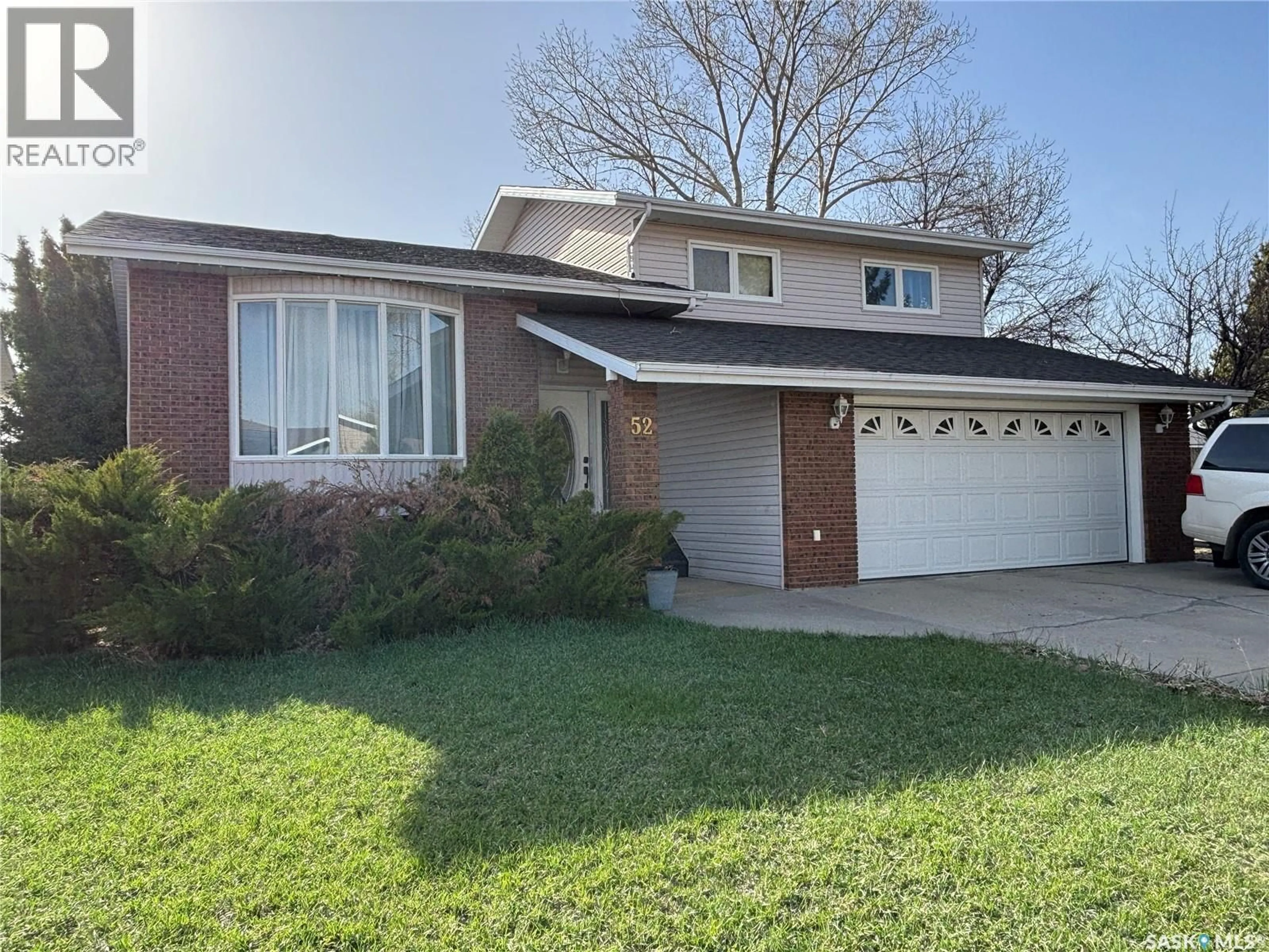 Home with vinyl exterior material, street for 52 HARRIGAN CRESCENT, Maple Creek Saskatchewan S0N1N0