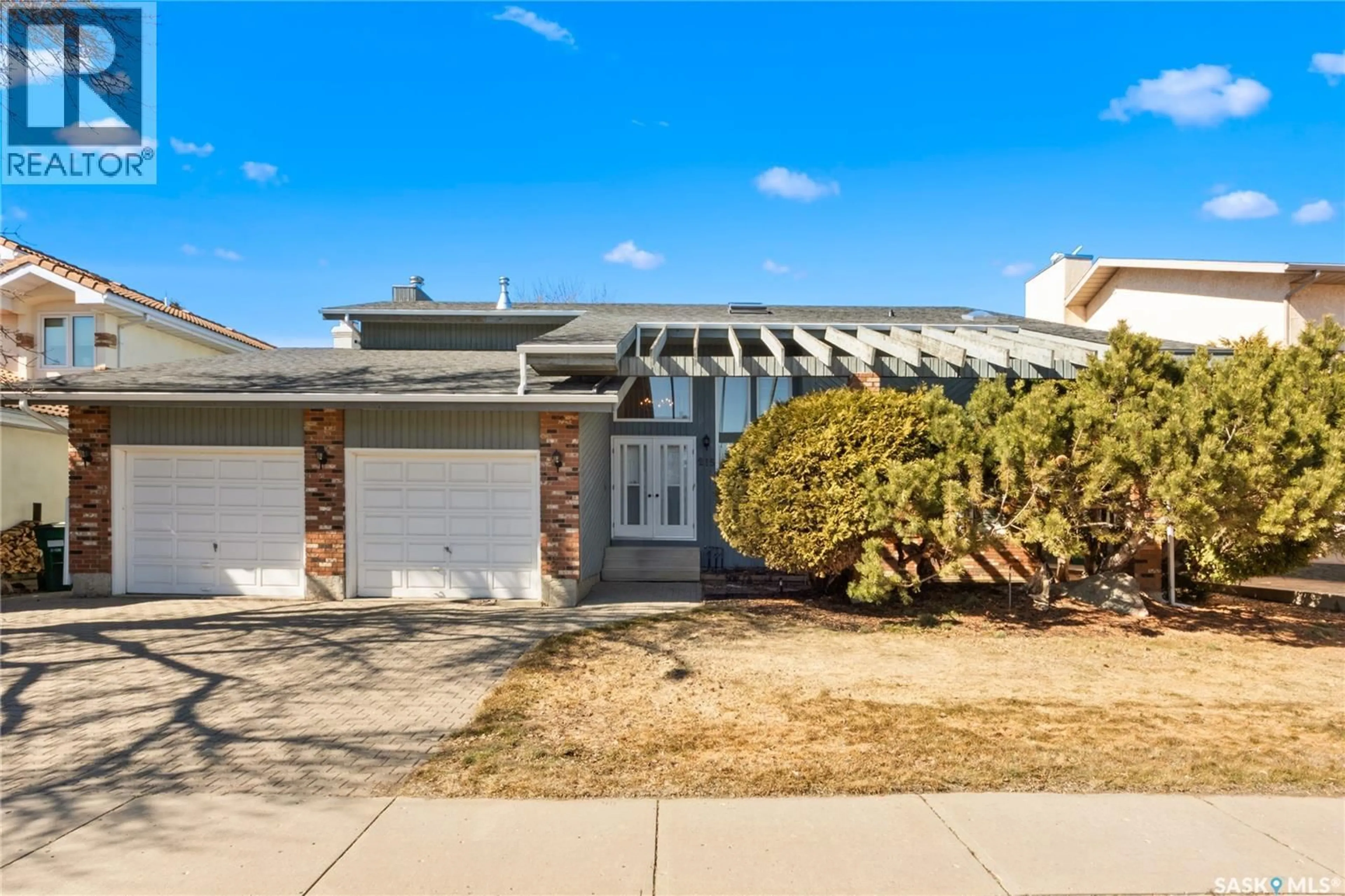 Home with vinyl exterior material, street for 215 MALLIN CRESCENT, Saskatoon Saskatchewan S7K7X3