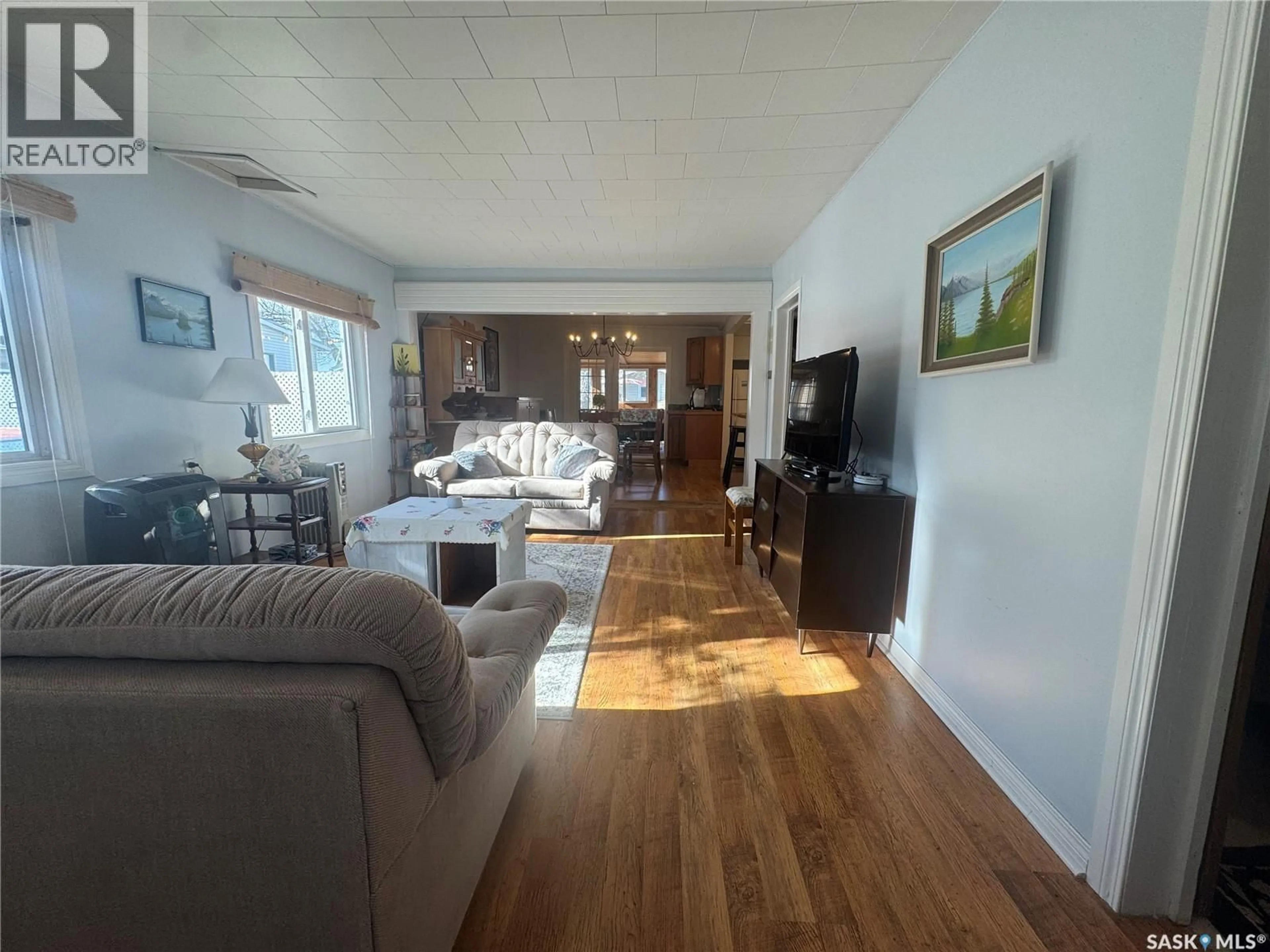 Living room with furniture, wood/laminate floor for 346A FAIRCHILD AVENUE, Regina Beach Saskatchewan S0G4C0