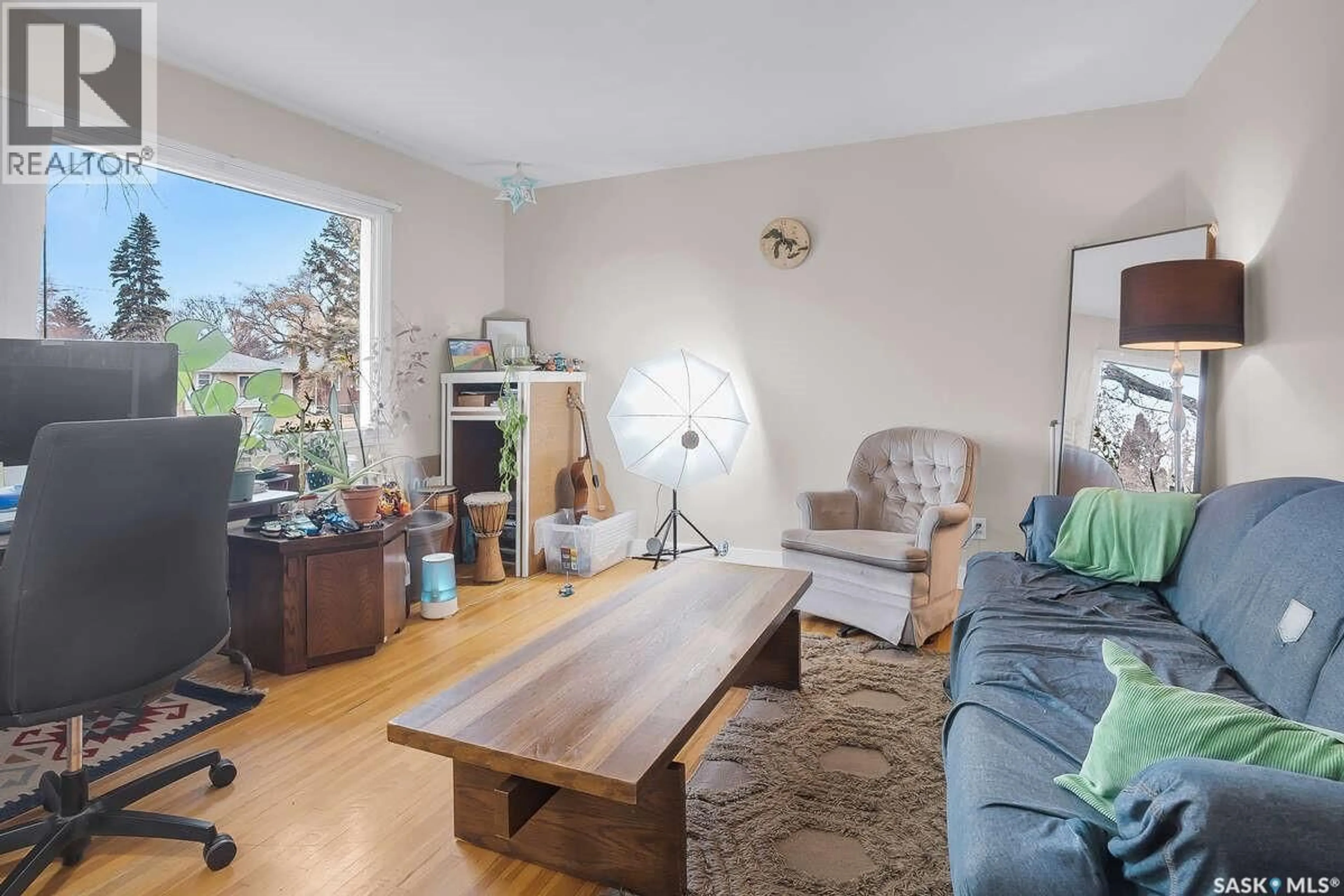 Living room with furniture, wood/laminate floor for 1711 BROADWAY AVENUE, Saskatoon Saskatchewan S7H2B4