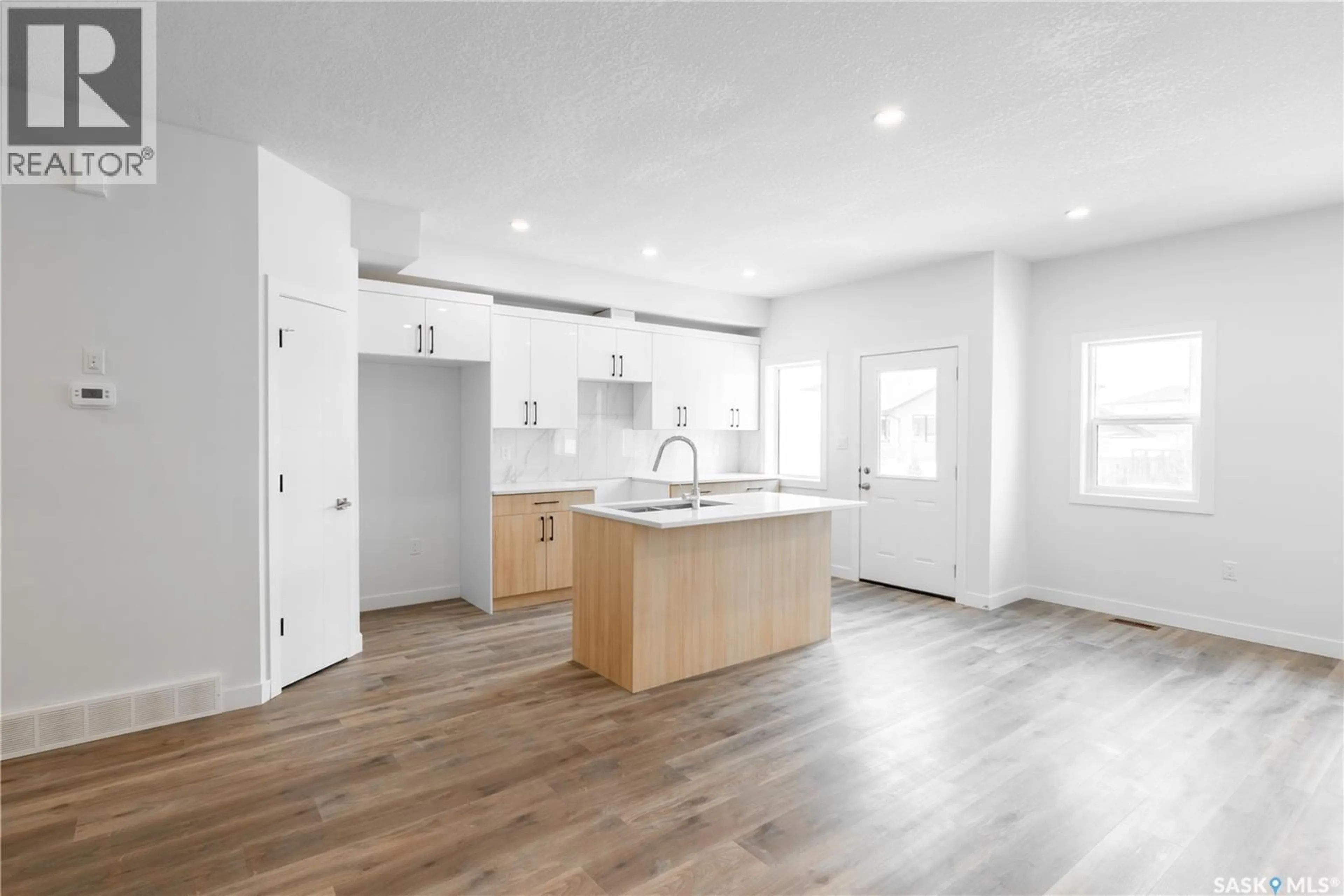 Open concept kitchen, wood/laminate floor for E - 4513 GREEN BROOKS WAY, Regina Saskatchewan S4V3K5