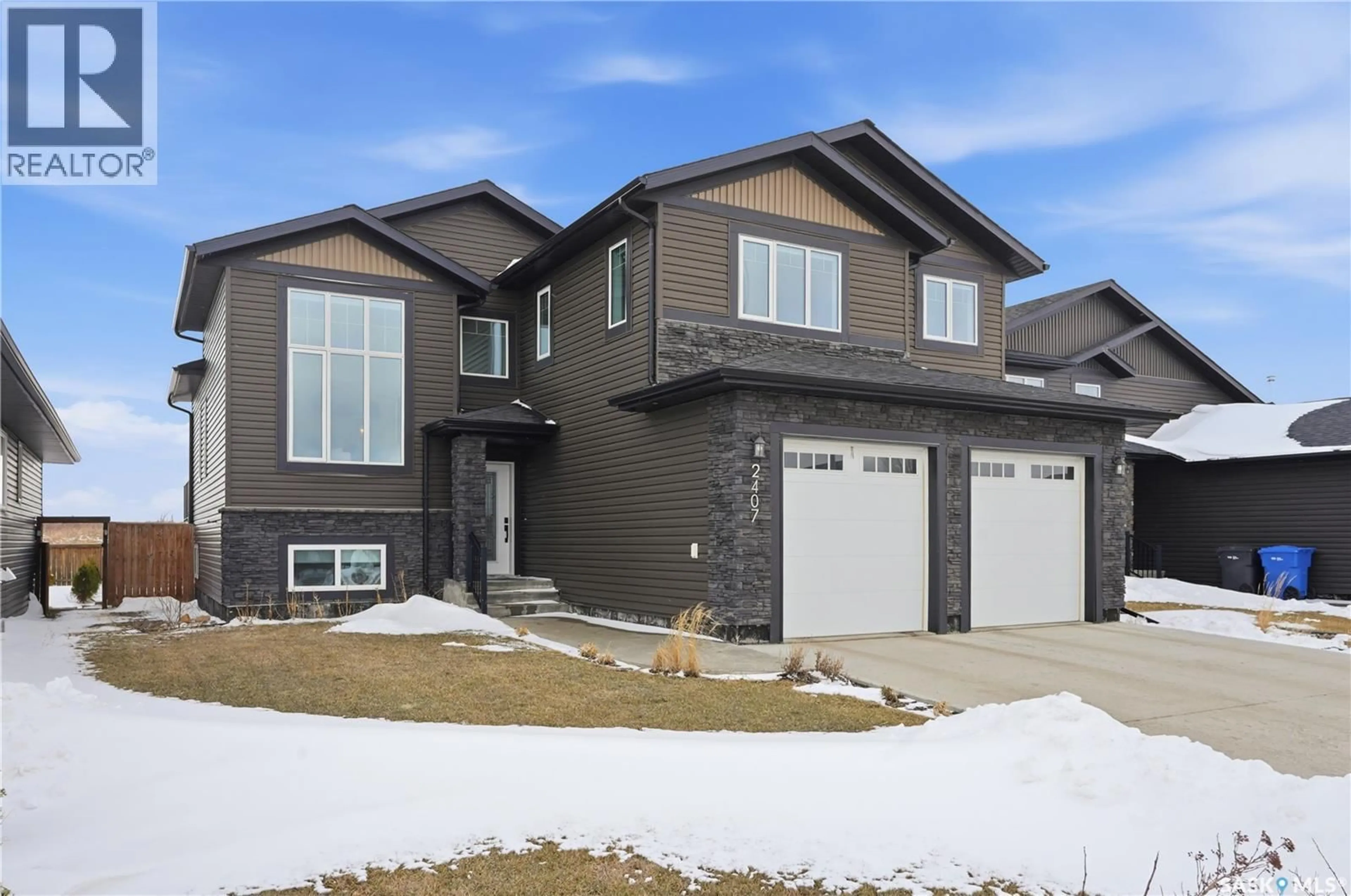 Home with vinyl exterior material, street for 2407 BUHLER AVENUE, North Battleford Saskatchewan S9A1J2