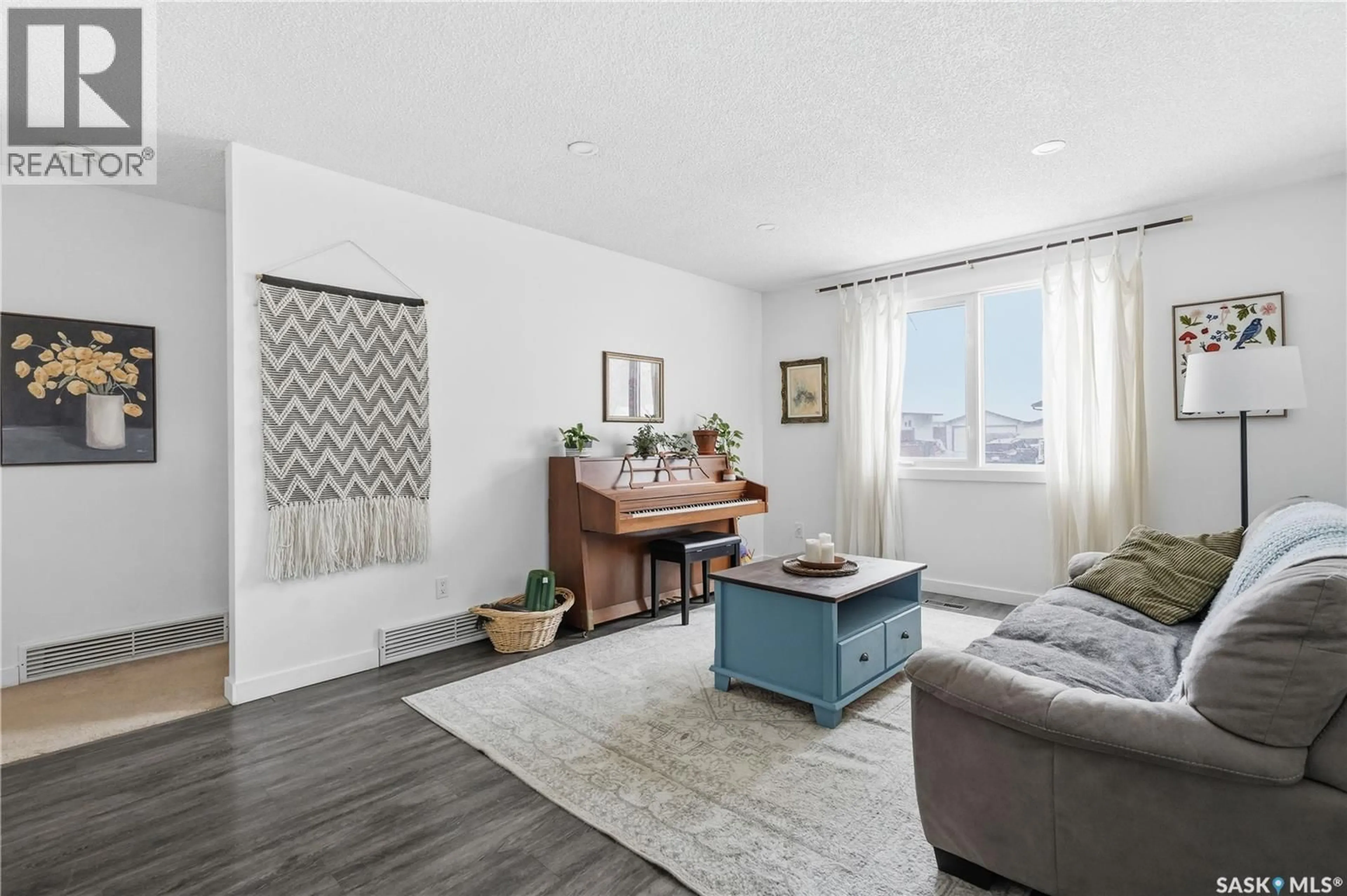 Living room with furniture, unknown for 166 MAGEE CRESCENT, Regina Saskatchewan S4R6K7