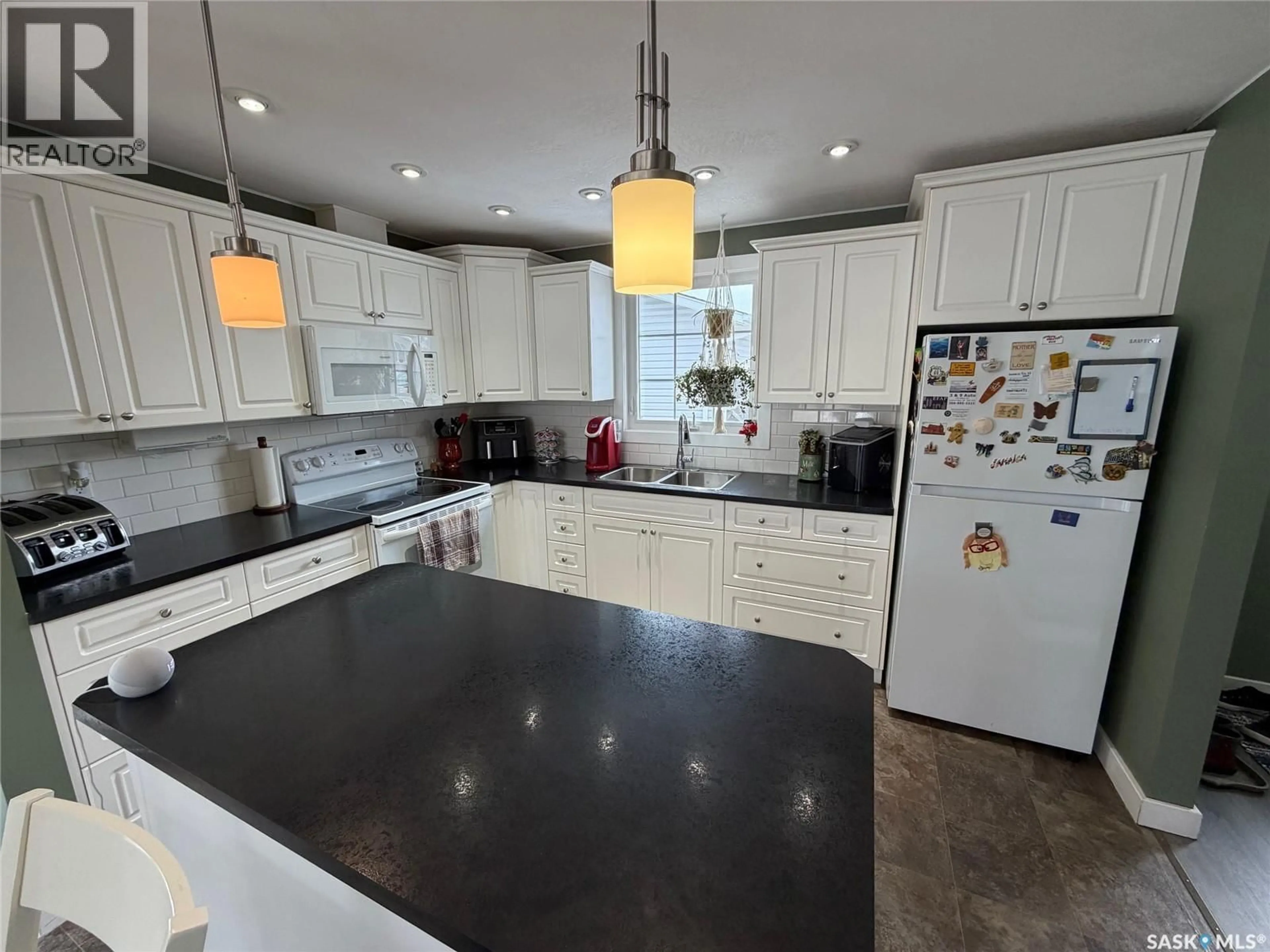 Open concept kitchen, ceramic/tile floor for 739 HUDSON CRESCENT, Hudson Bay Saskatchewan S0E0Y0