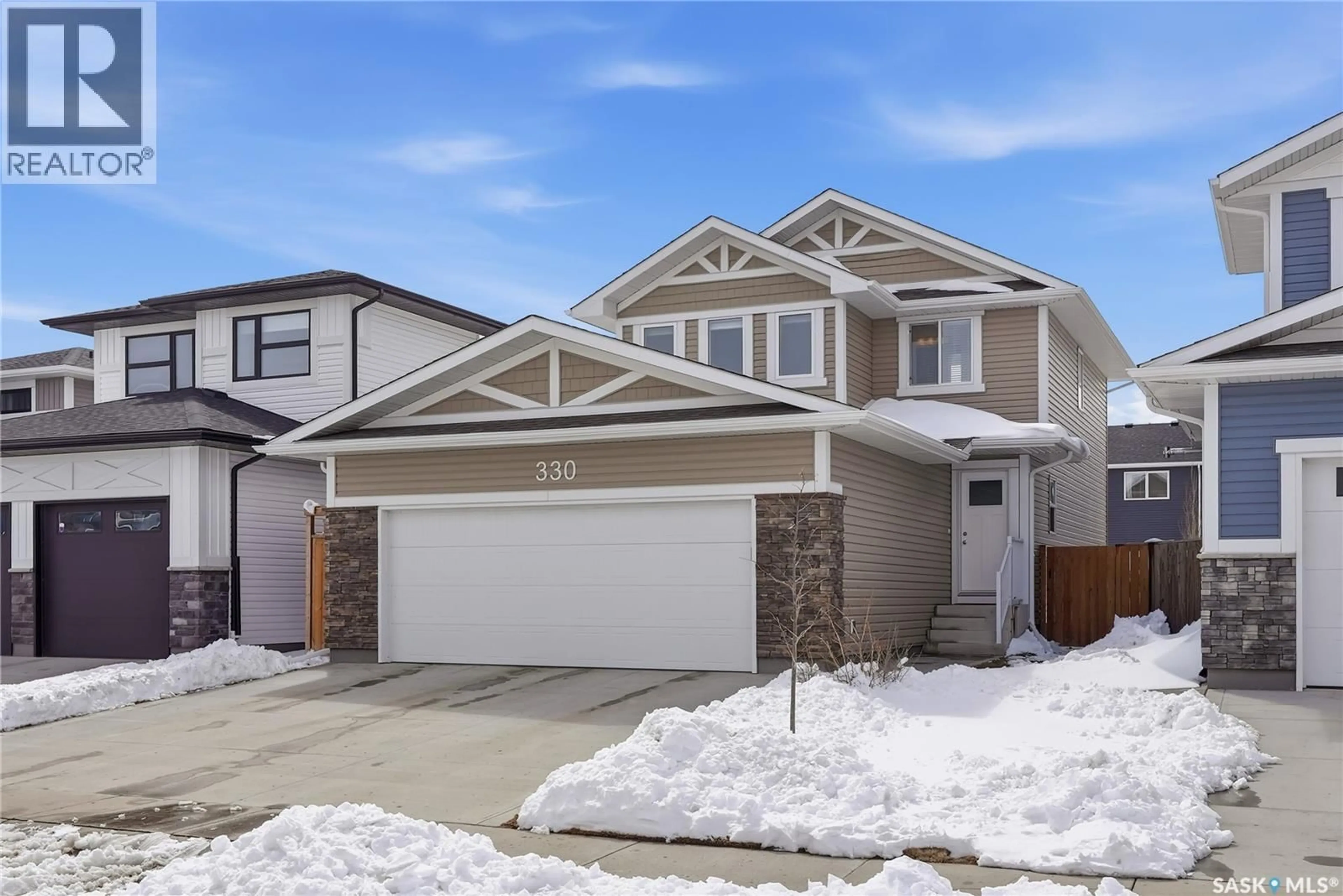 Home with vinyl exterior material, street for 330 GERMAIN MANOR, Saskatoon Saskatchewan S7V0T7