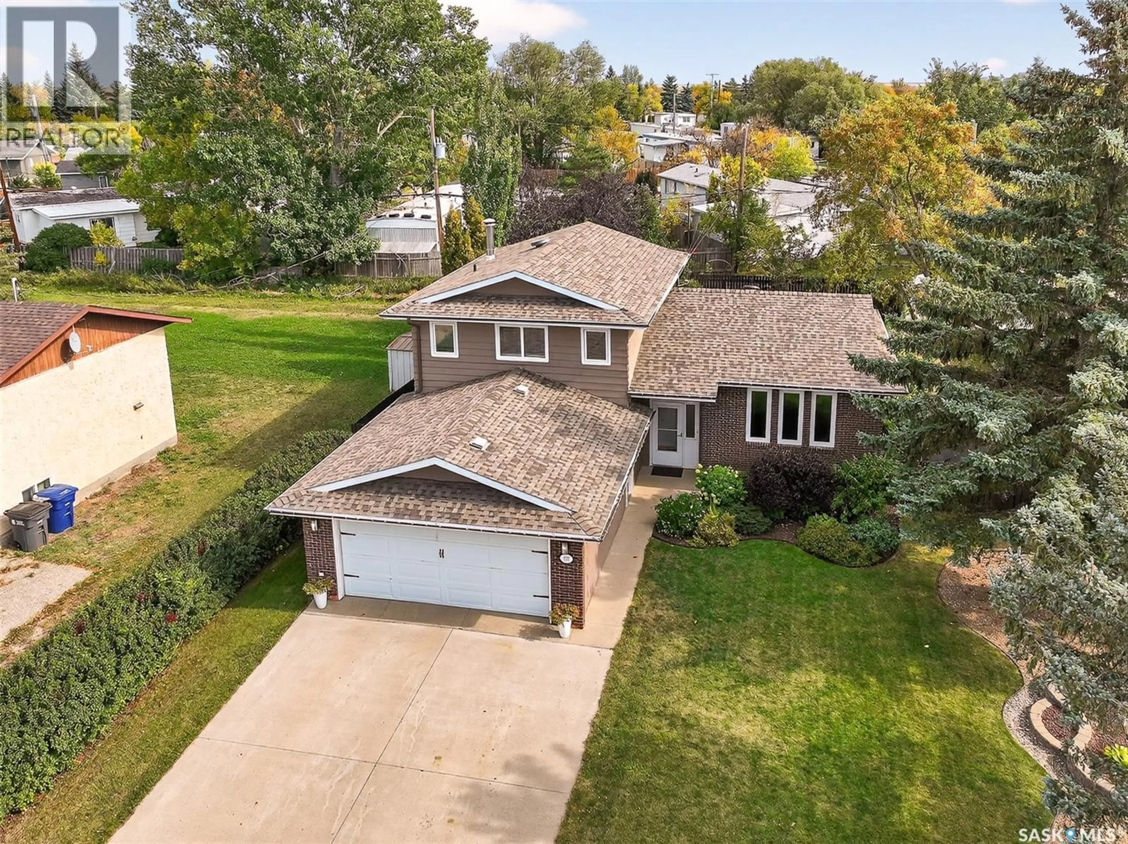 A pic from outside/outdoor area/front of a property/back of a property/a pic from drone, street for 107 COTTONWOOD STREET, Caronport Saskatchewan S0H0S0