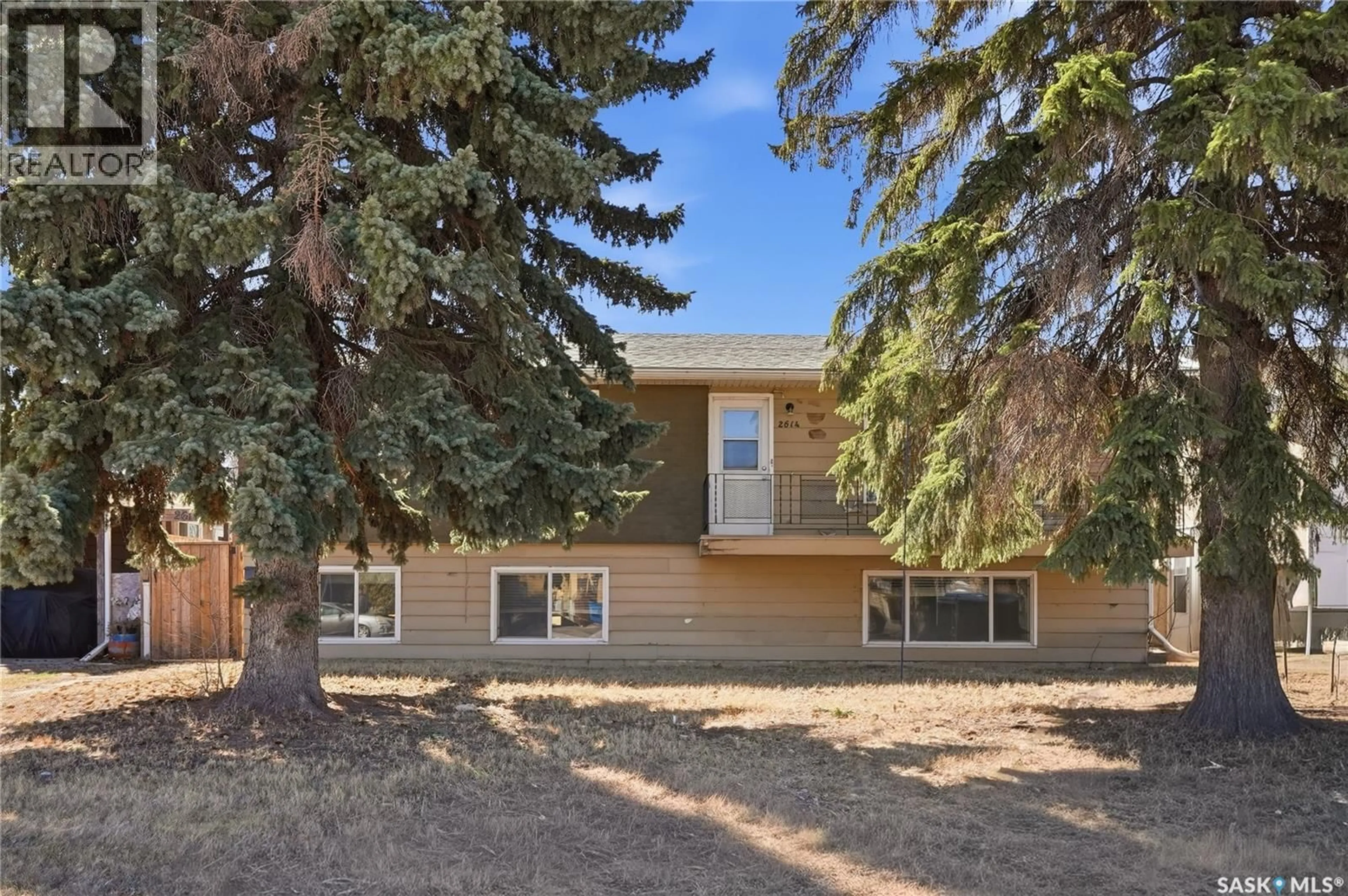 Home with vinyl exterior material, street for 2614 7TH STREET, Saskatoon Saskatchewan S7H1A5