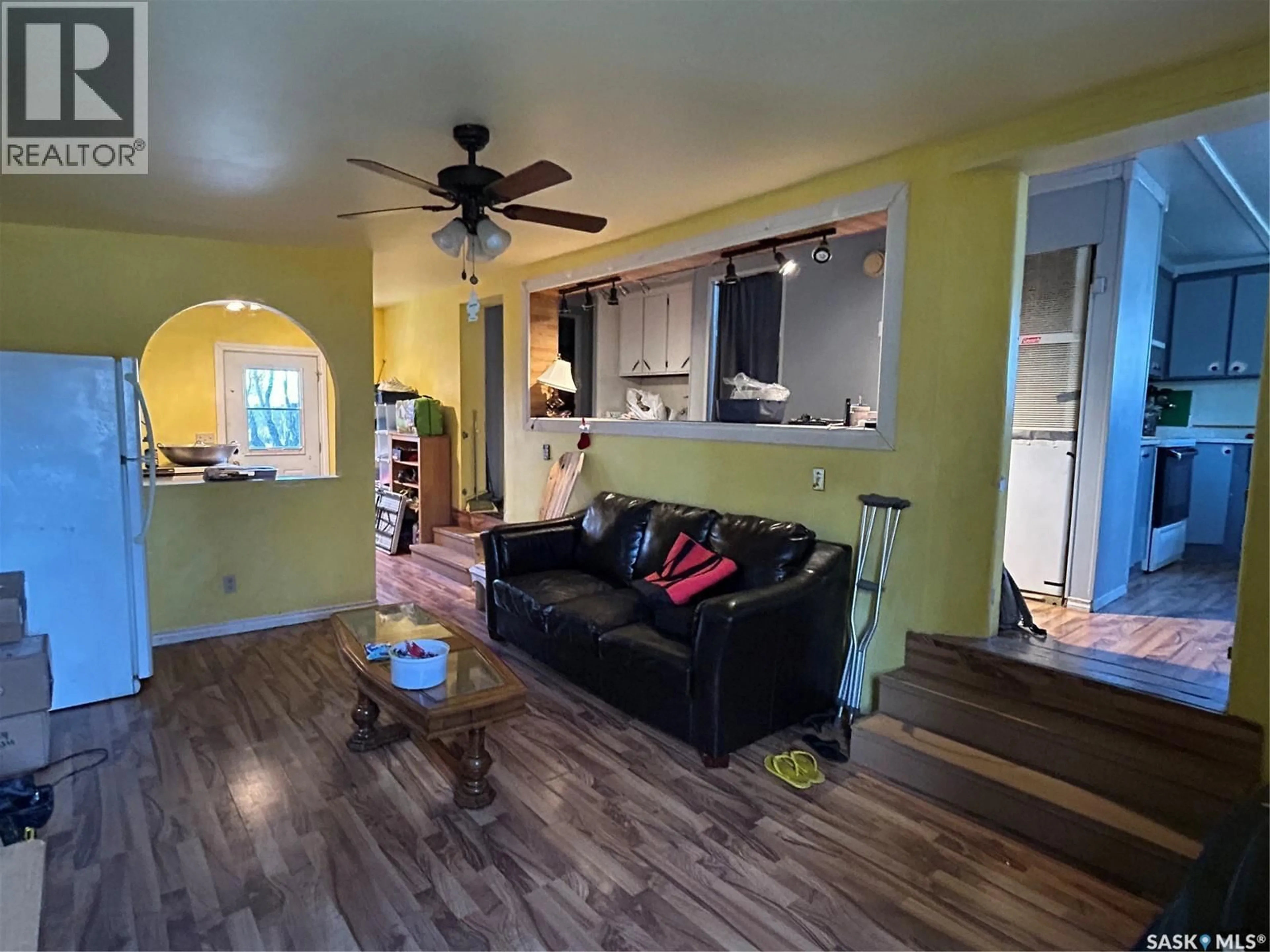 Living room with furniture, wood/laminate floor for 833 BERYL AVENUE, Oxbow Saskatchewan S0C2B0