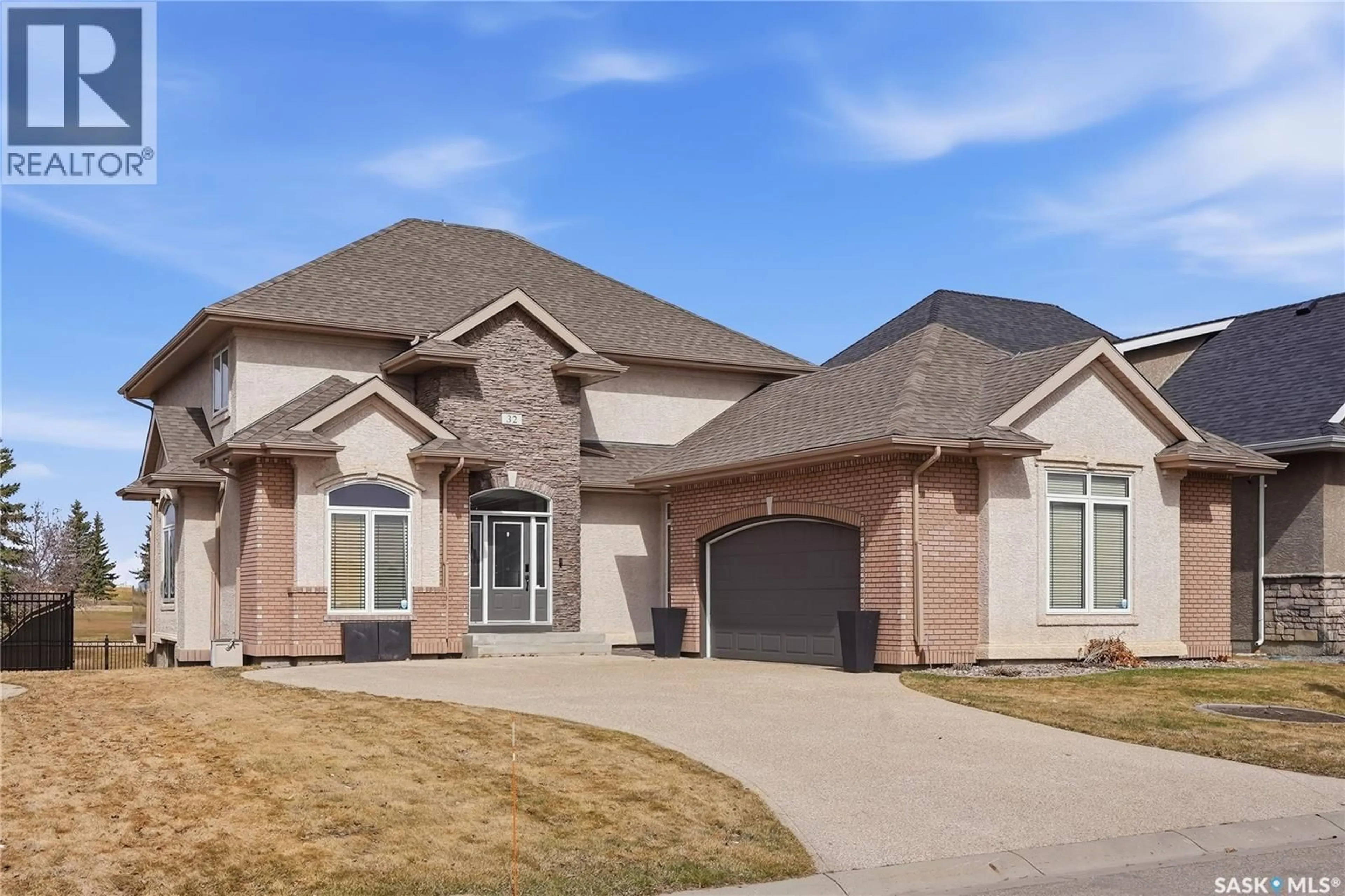 Home with brick exterior material, street for 32 501 CARTWRIGHT STREET, Saskatoon Saskatchewan S7T1E1