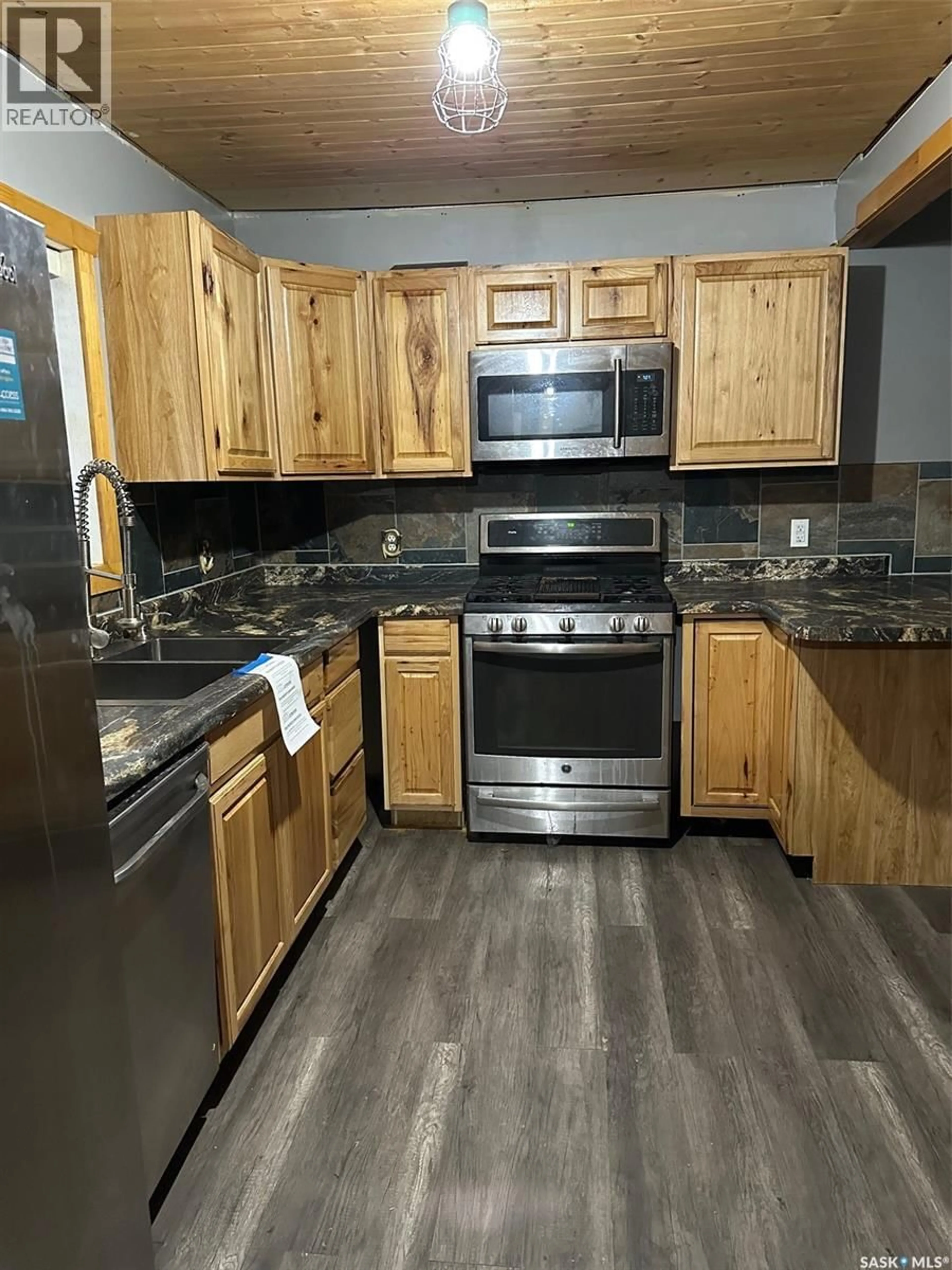 Standard kitchen, wood/laminate floor for 321 WALSH STREET, Bienfait Saskatchewan S0C0M0