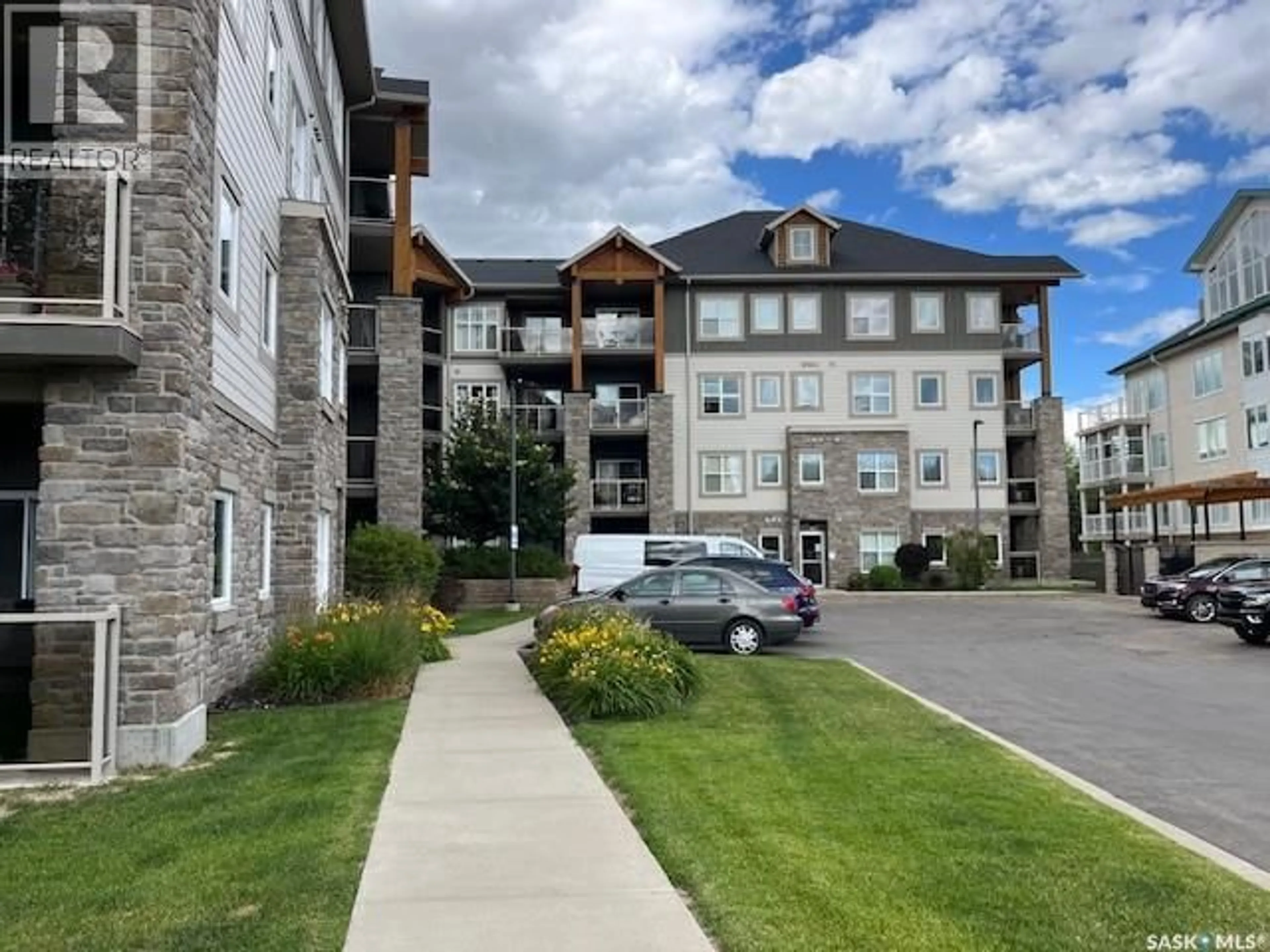 A pic from outside/outdoor area/front of a property/back of a property/a pic from drone, mountain view for 1220 - 313 BLACKFOOT DRIVE, Regina Saskatchewan S4S6T2