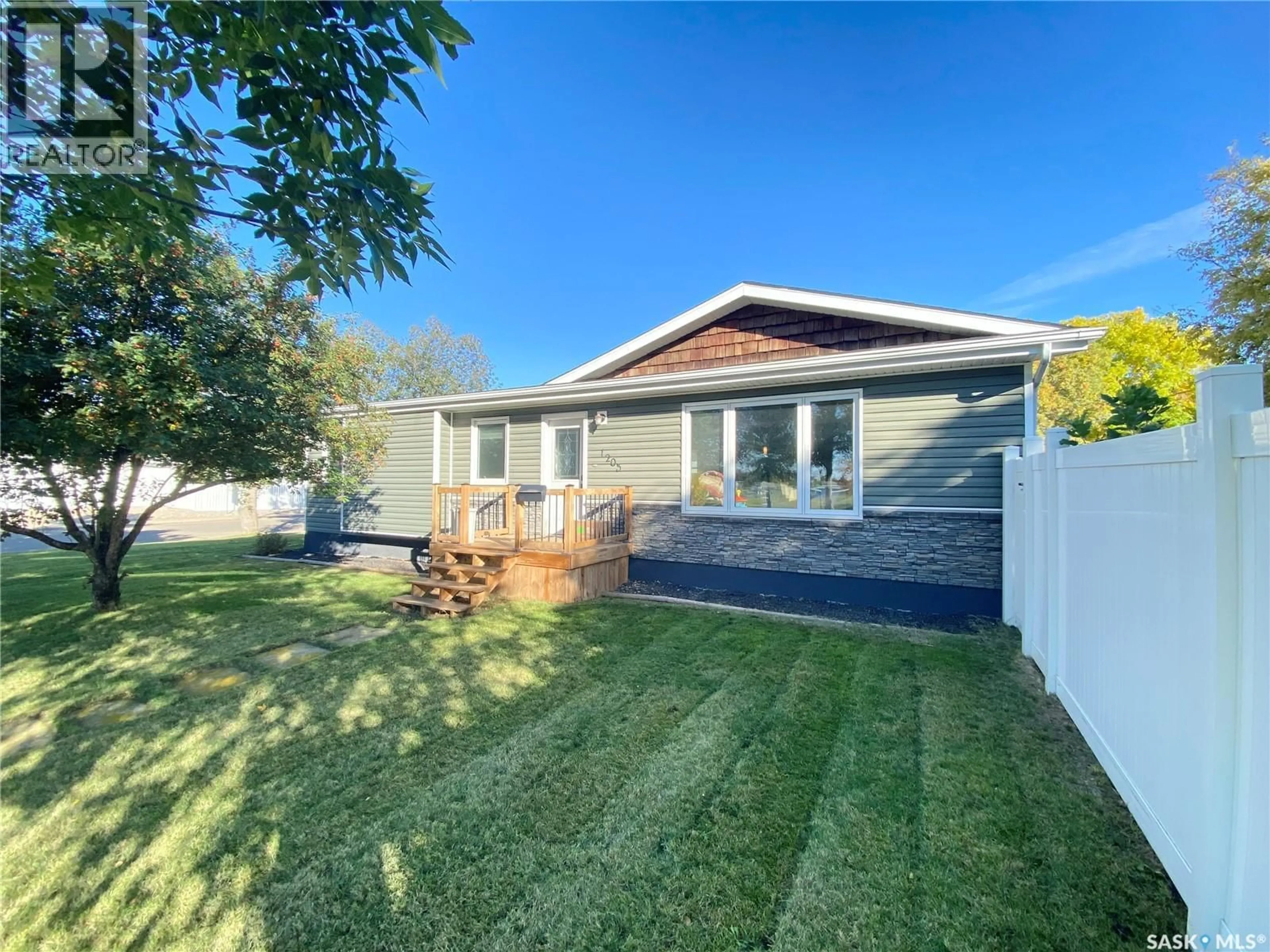 A pic from outside/outdoor area/front of a property/back of a property/a pic from drone, street for 1205 DOUGLAS ROAD, Weyburn Saskatchewan S4H2P9