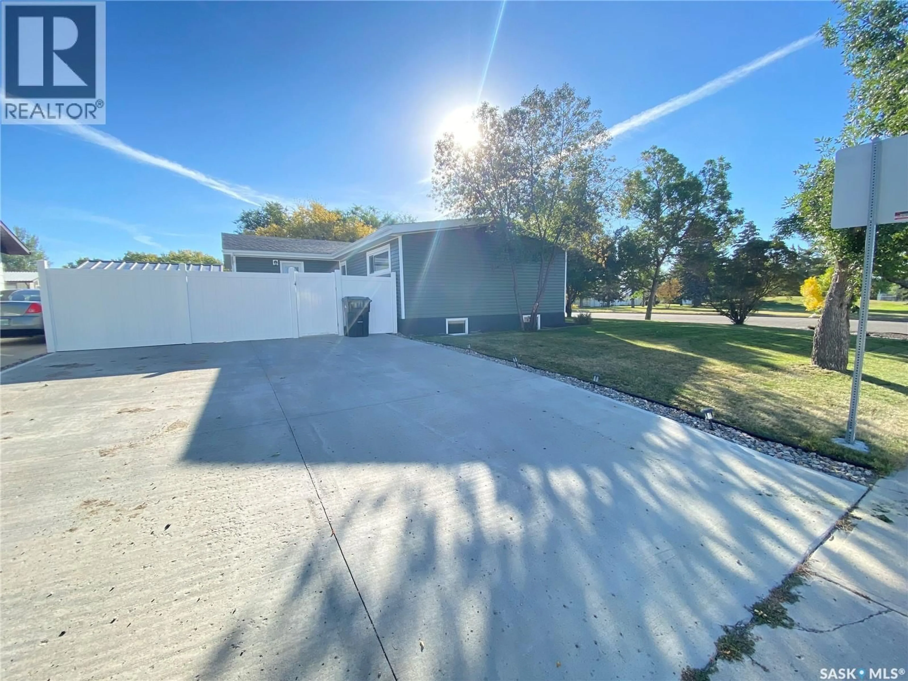 A pic from outside/outdoor area/front of a property/back of a property/a pic from drone, street for 1205 DOUGLAS ROAD, Weyburn Saskatchewan S4H2P9