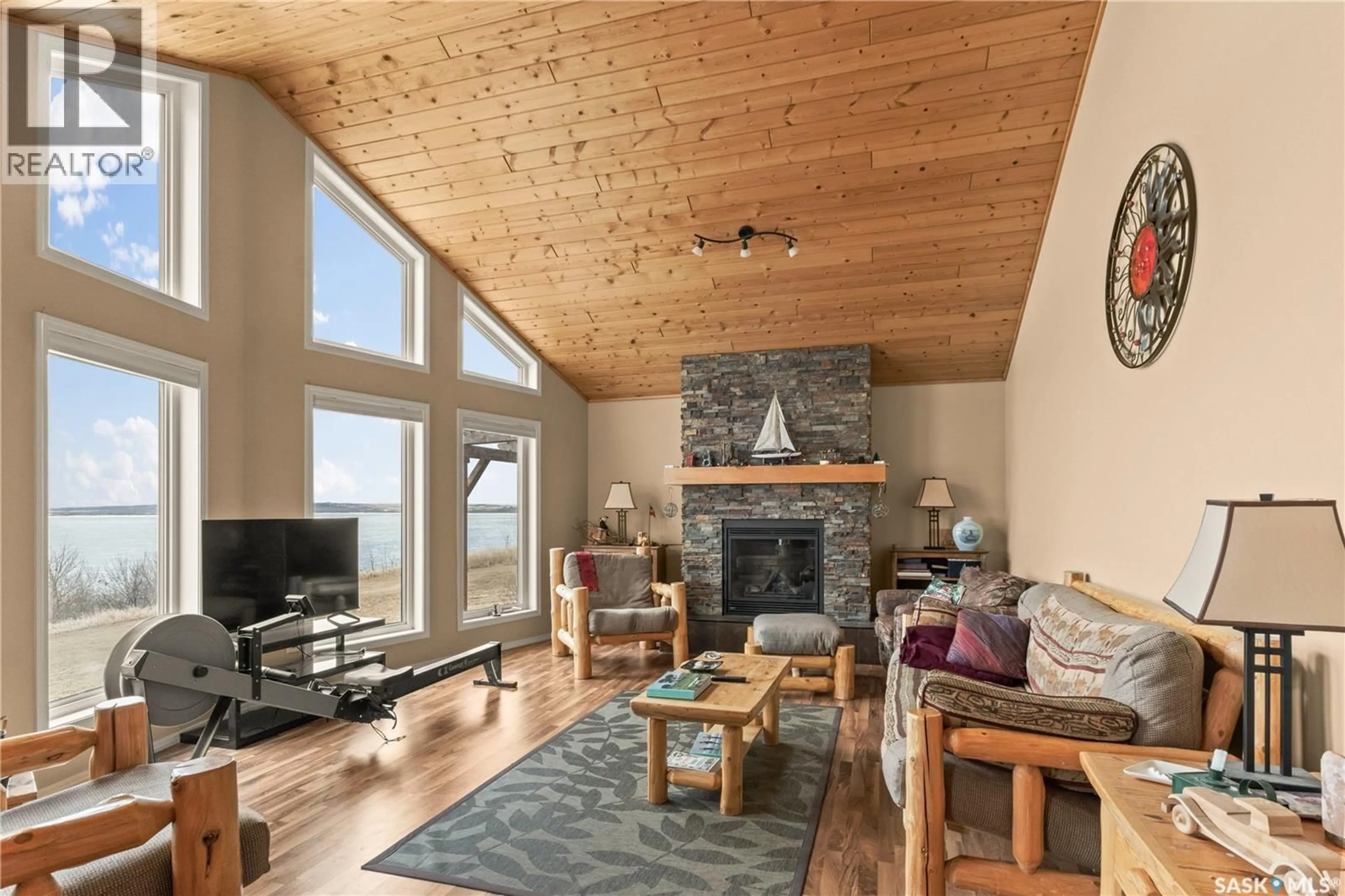 Living room with furniture, wood/laminate floor for 4 PELLETIER POINT, Redberry Rm No. 435 Saskatchewan S0J1A0