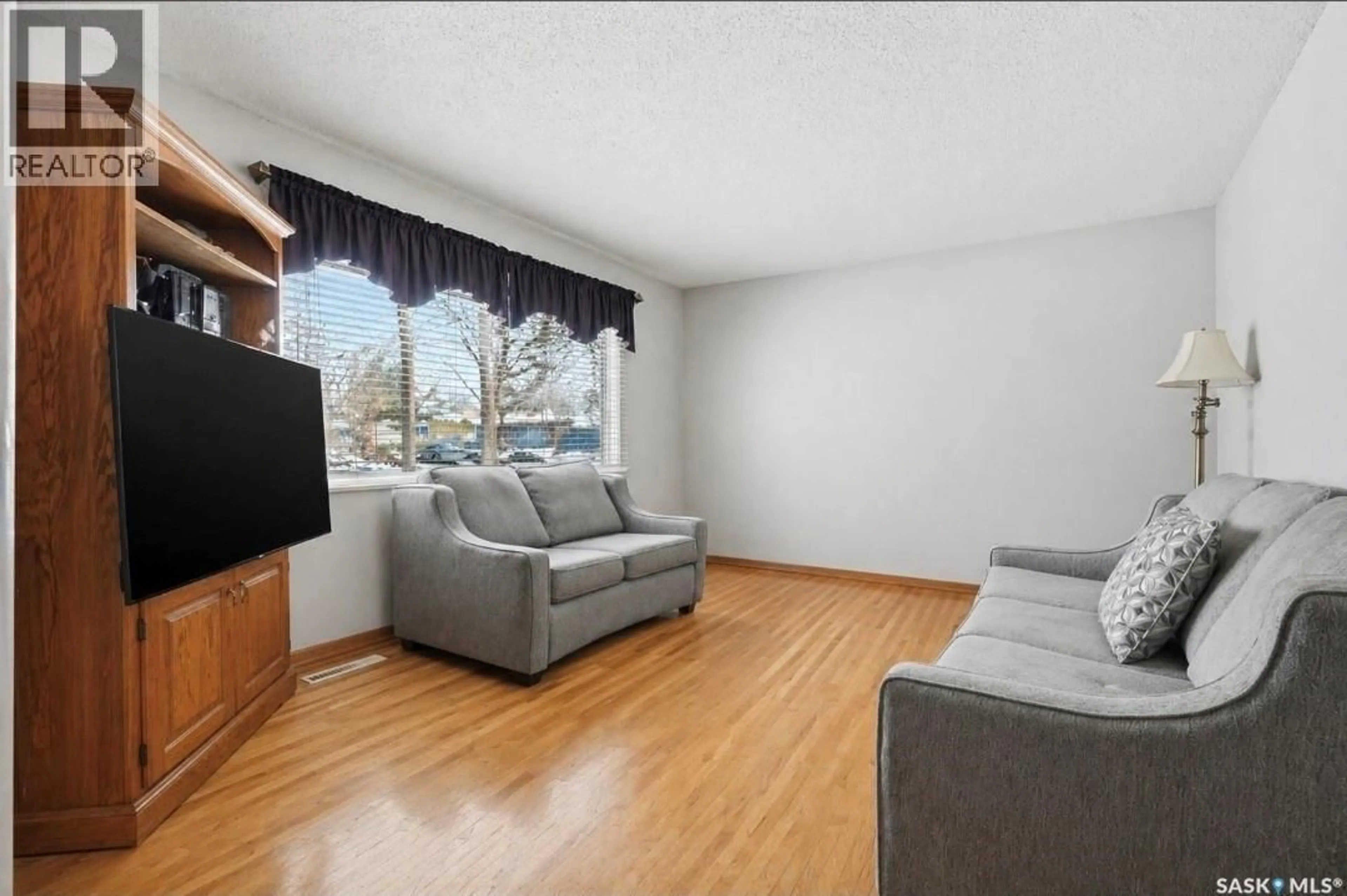 Living room with furniture, unknown for 51 MCASKILL CRESCENT, Saskatoon Saskatchewan S7J3K1