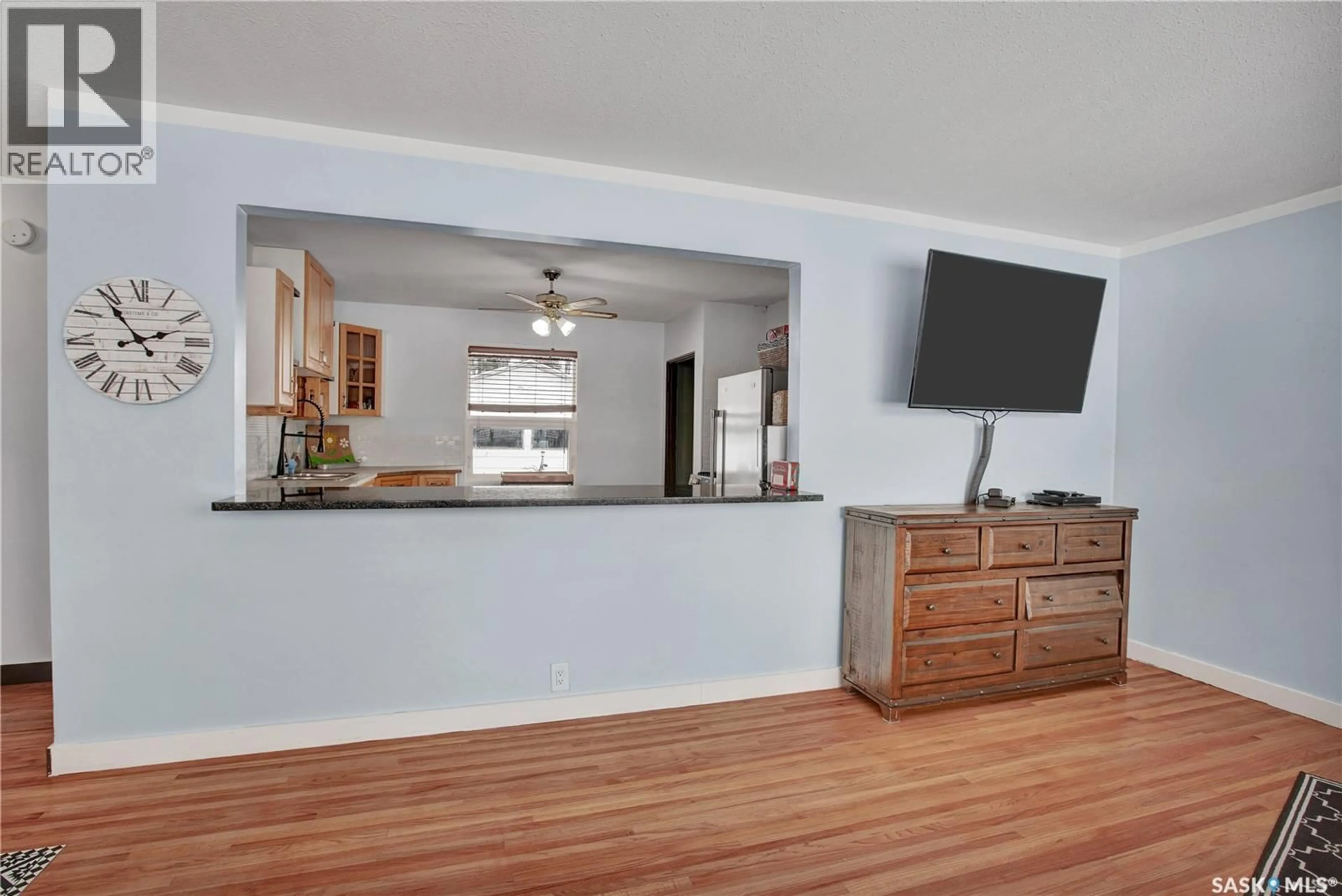 Open concept kitchen, wood/laminate floor for 1909 WIGGINS AVENUE, Saskatoon Saskatchewan S7J1W2