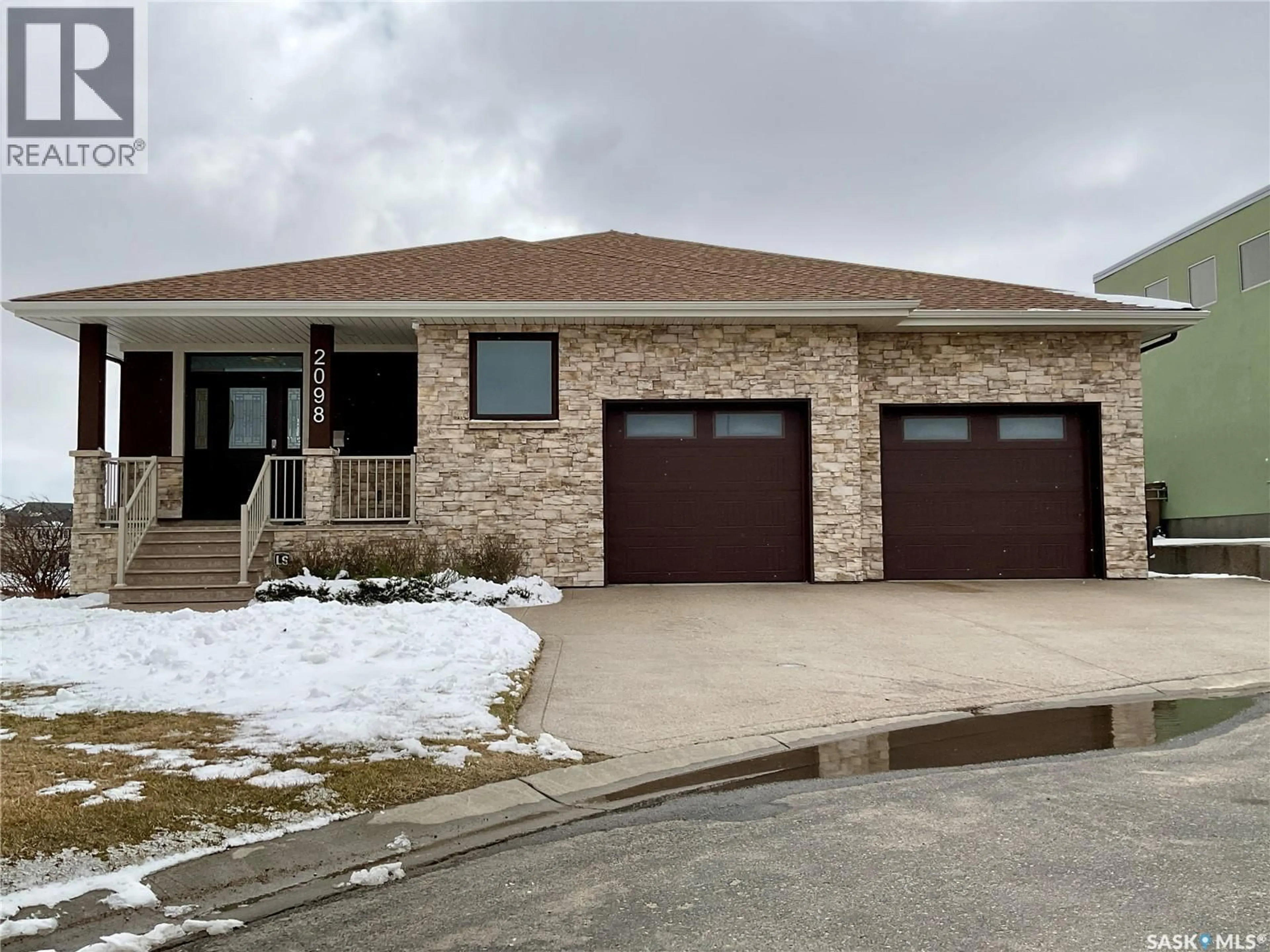 Home with brick exterior material, street for 2098 RIVERBEND VIEW, Regina Saskatchewan S4V1R8