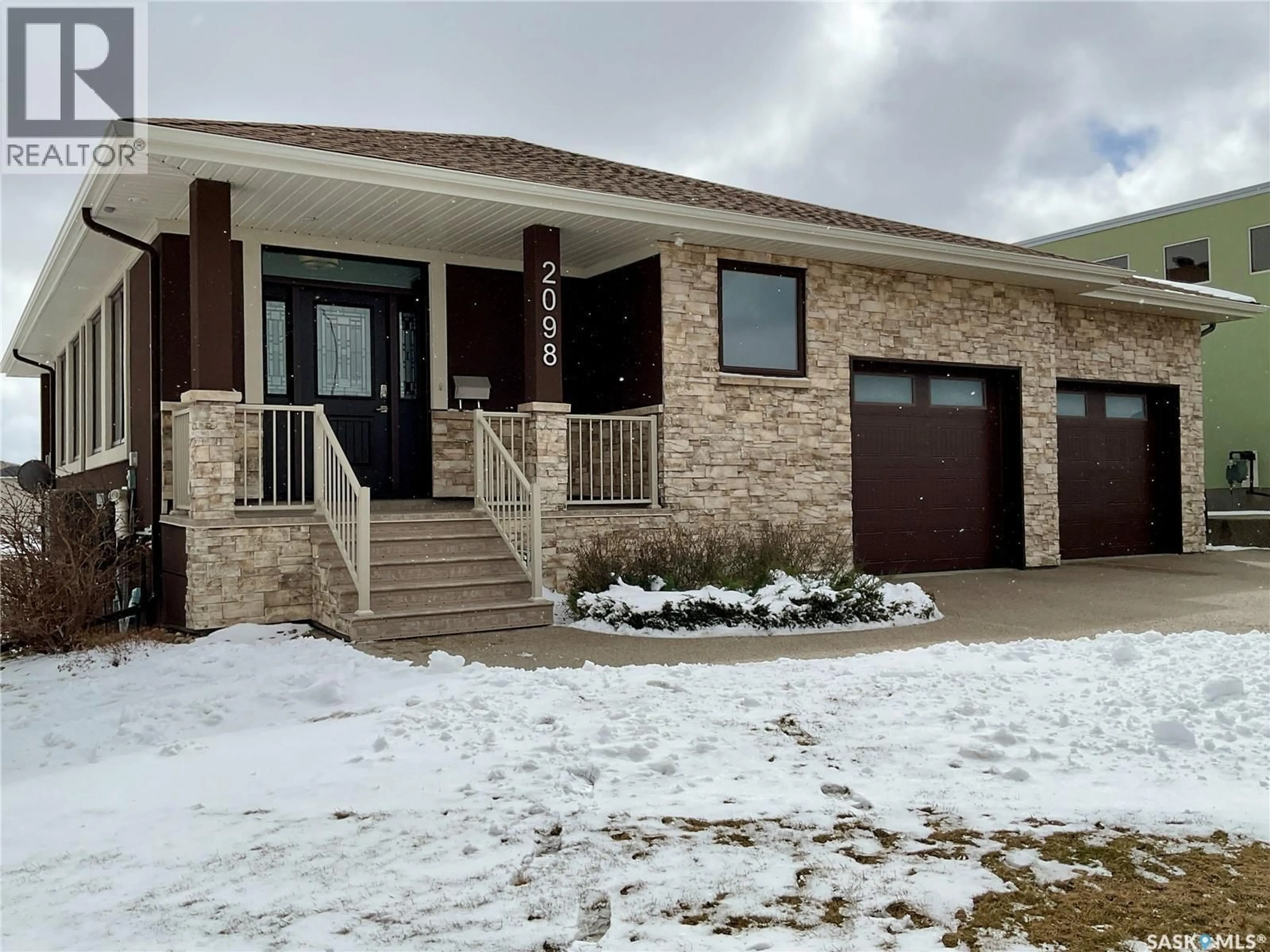 Home with brick exterior material, street for 2098 RIVERBEND VIEW, Regina Saskatchewan S4V1R8