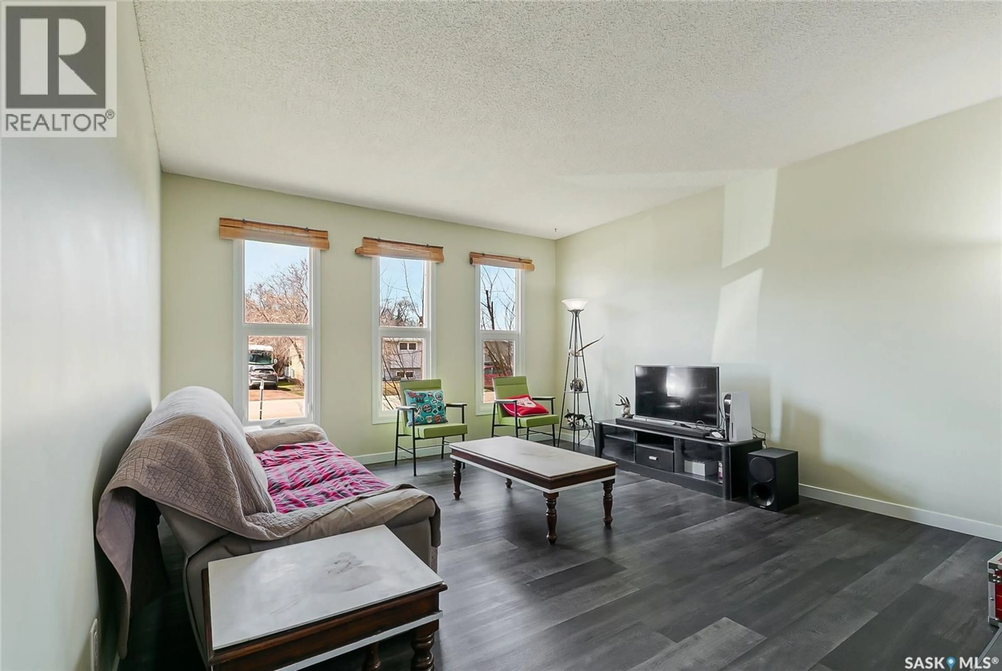 Living room with furniture, wood/laminate floor for 155 BROAD STREET, Lumsden Saskatchewan S0G3C0