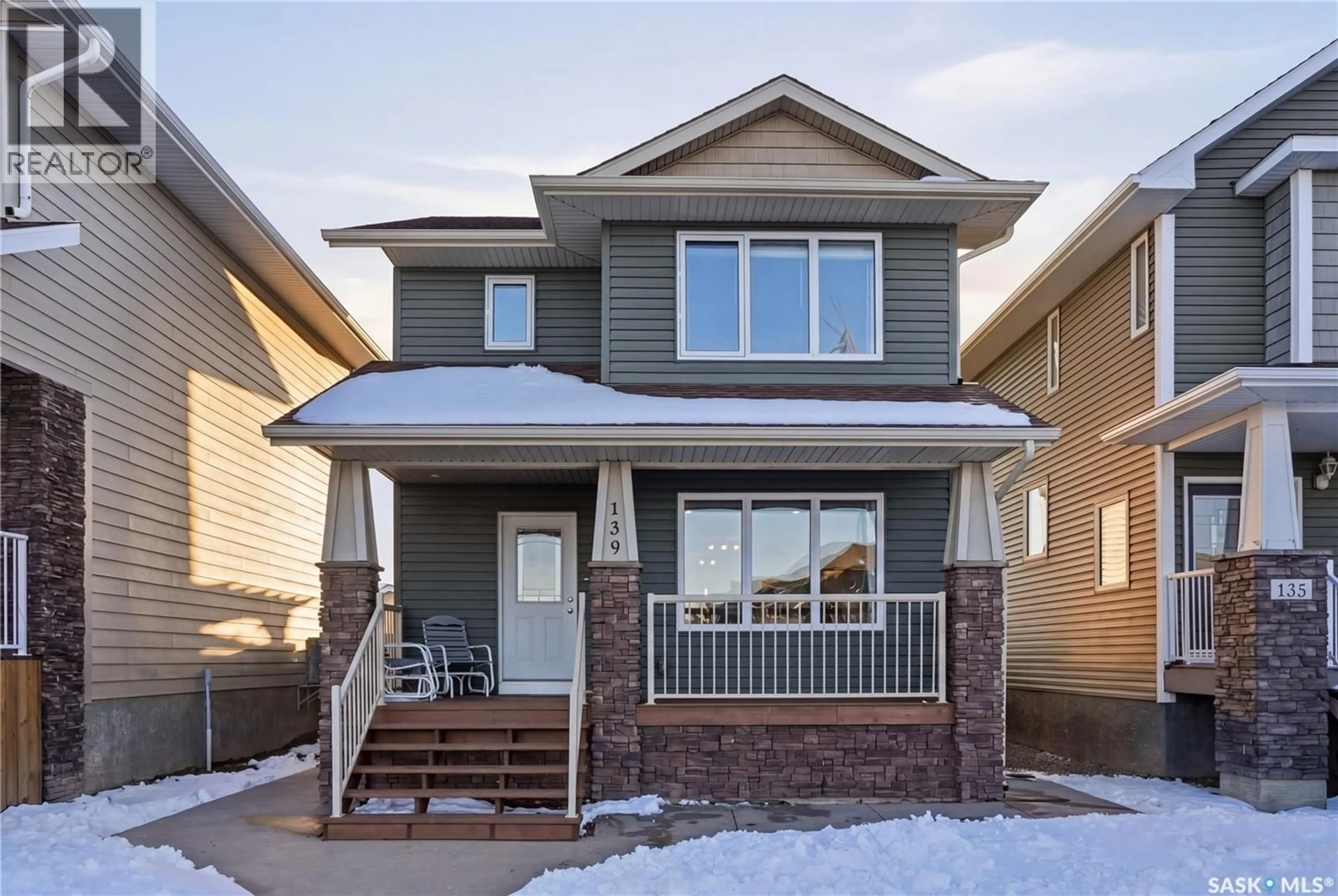 Home with vinyl exterior material, street for 139 MANINGAS BEND, Saskatoon Saskatchewan S7W0L4