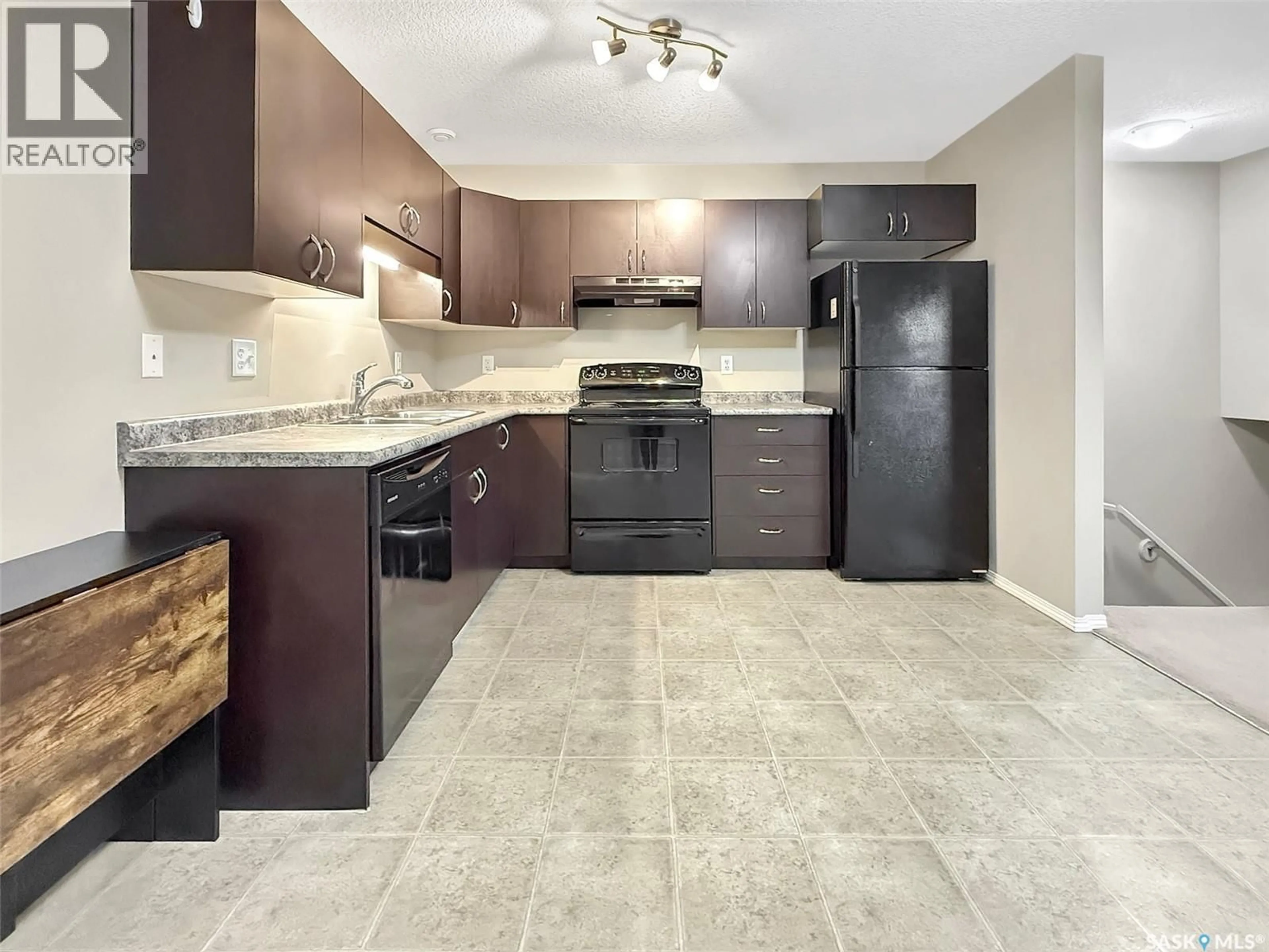 Open concept kitchen, ceramic/tile floor for 700 - 322 BATTLEFORD TRAIL, Swift Current Saskatchewan S9H4V9