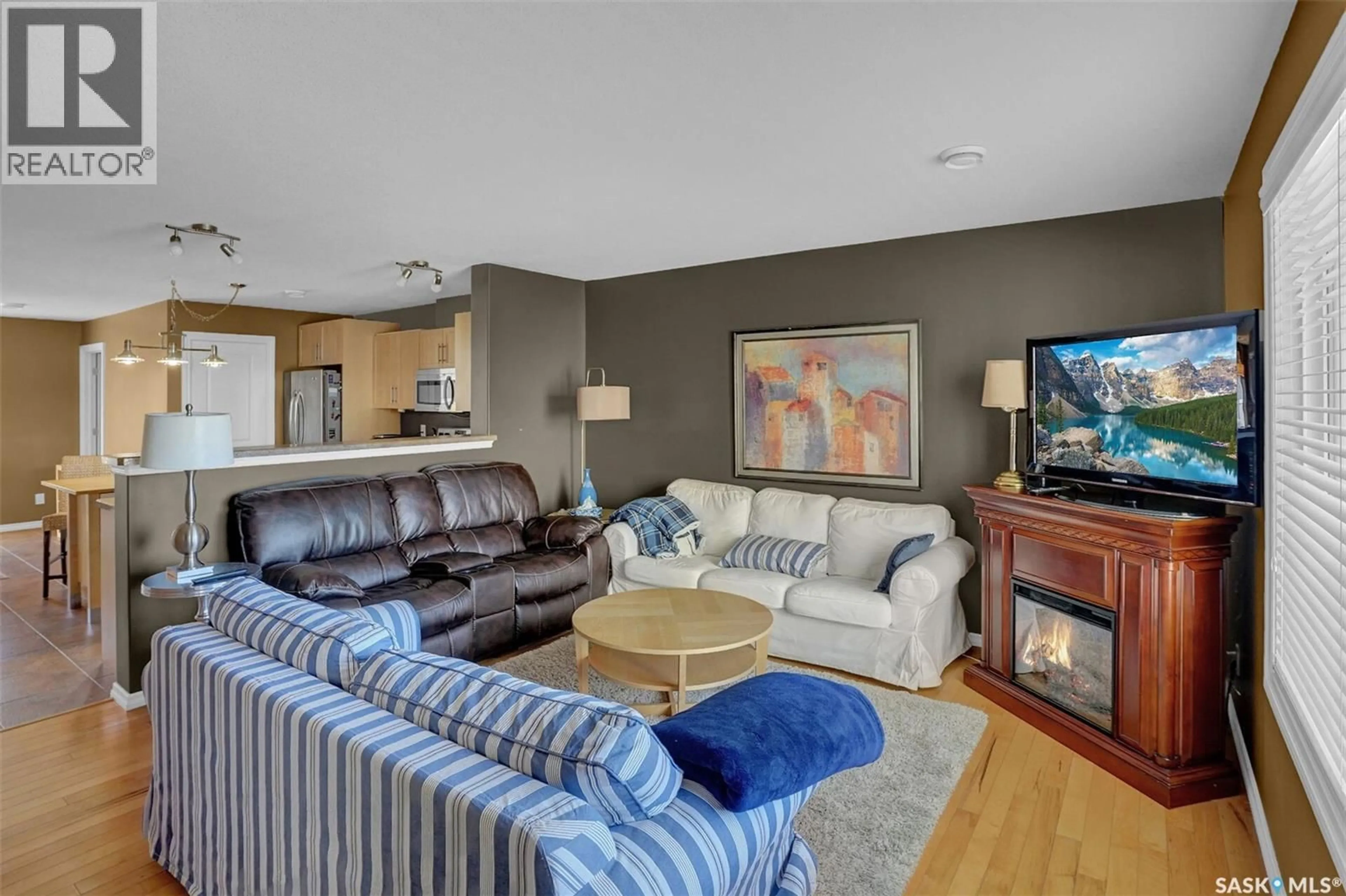 Living room with furniture, unknown for 3225 - 8 WOODHAMS DRIVE, Regina Saskatchewan S4V3A2