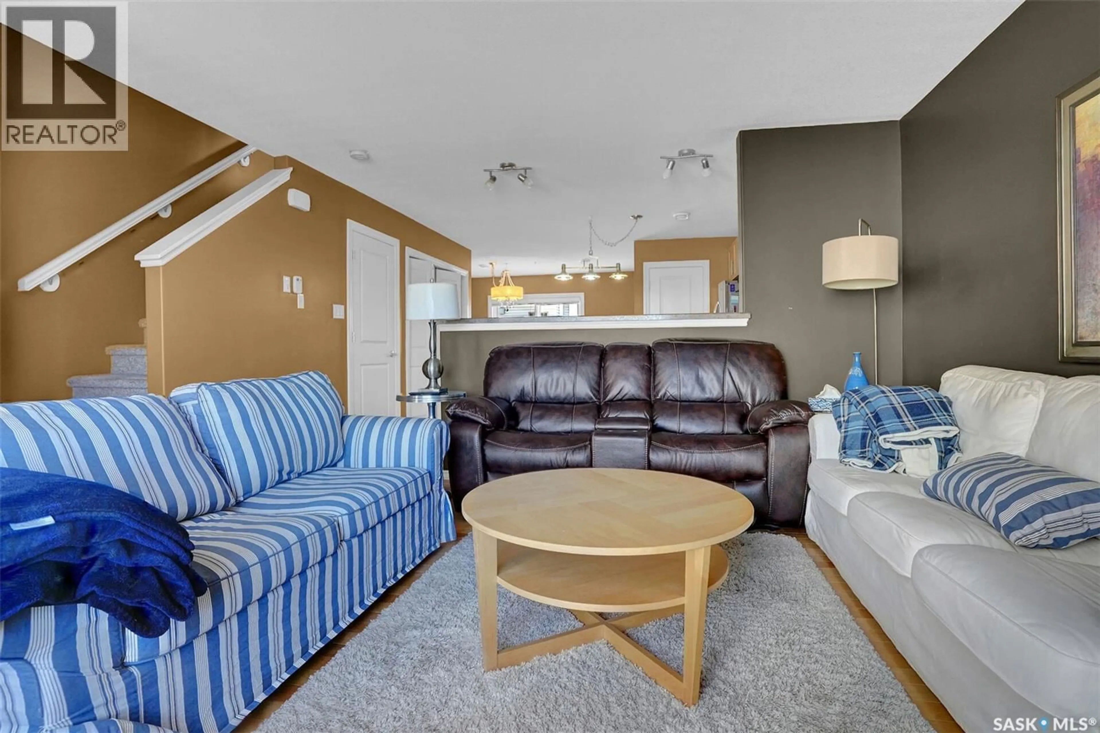 Living room with furniture, unknown for 3225 - 8 WOODHAMS DRIVE, Regina Saskatchewan S4V3A2