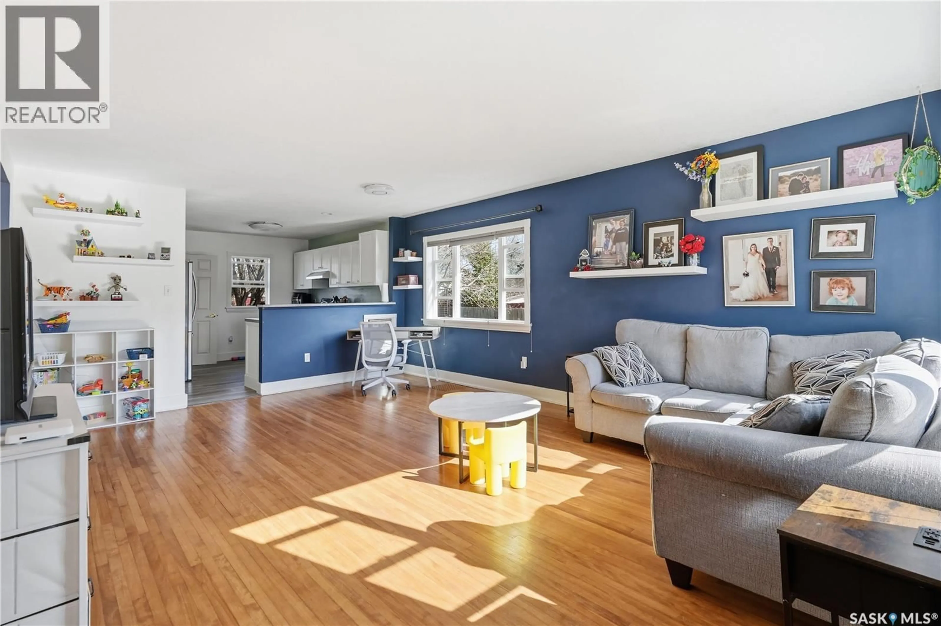 Living room with furniture, wood/laminate floor for 2425 ATKINSON STREET, Regina Saskatchewan S4N3X6