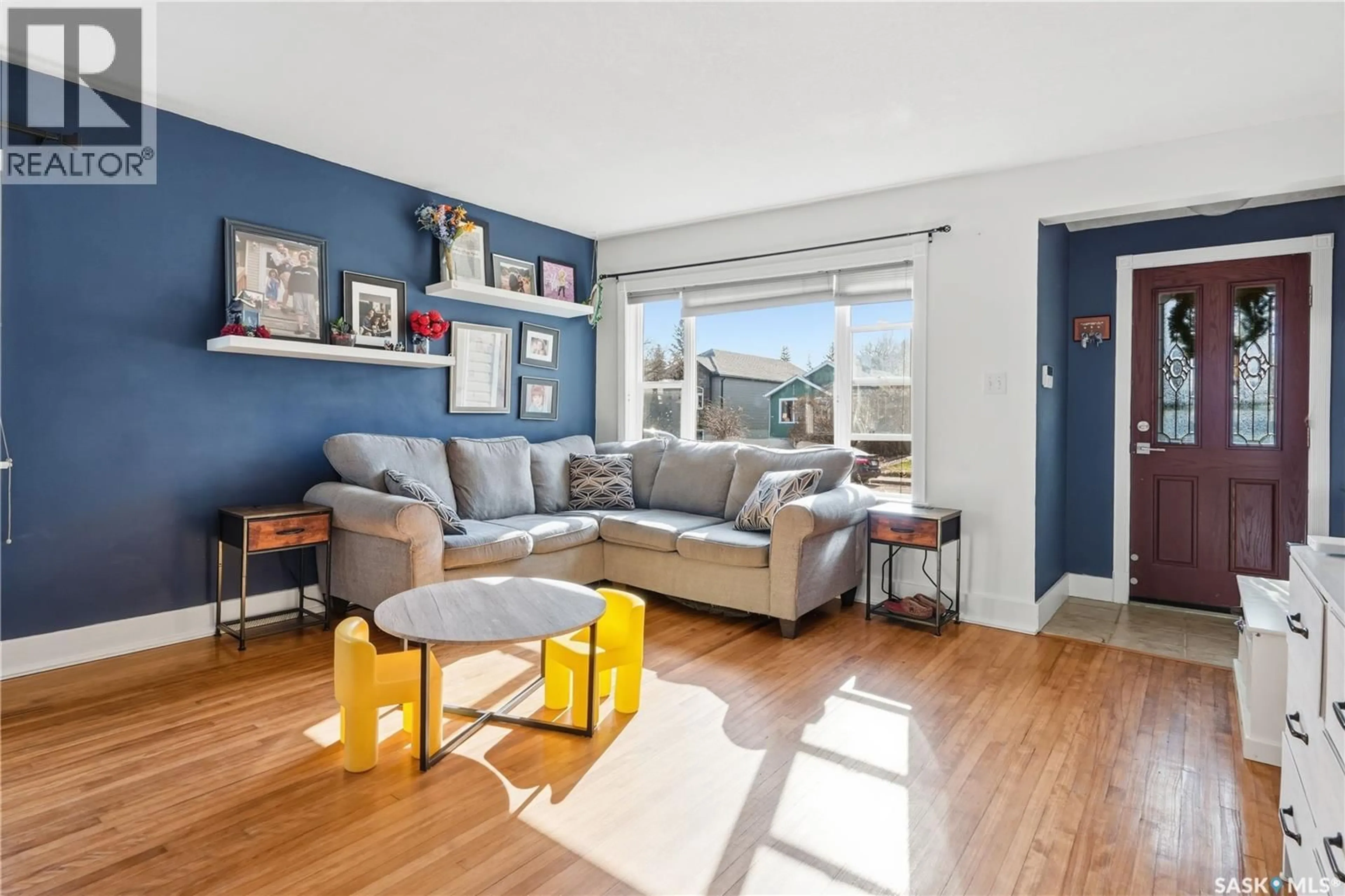 Living room with furniture, wood/laminate floor for 2425 ATKINSON STREET, Regina Saskatchewan S4N3X6