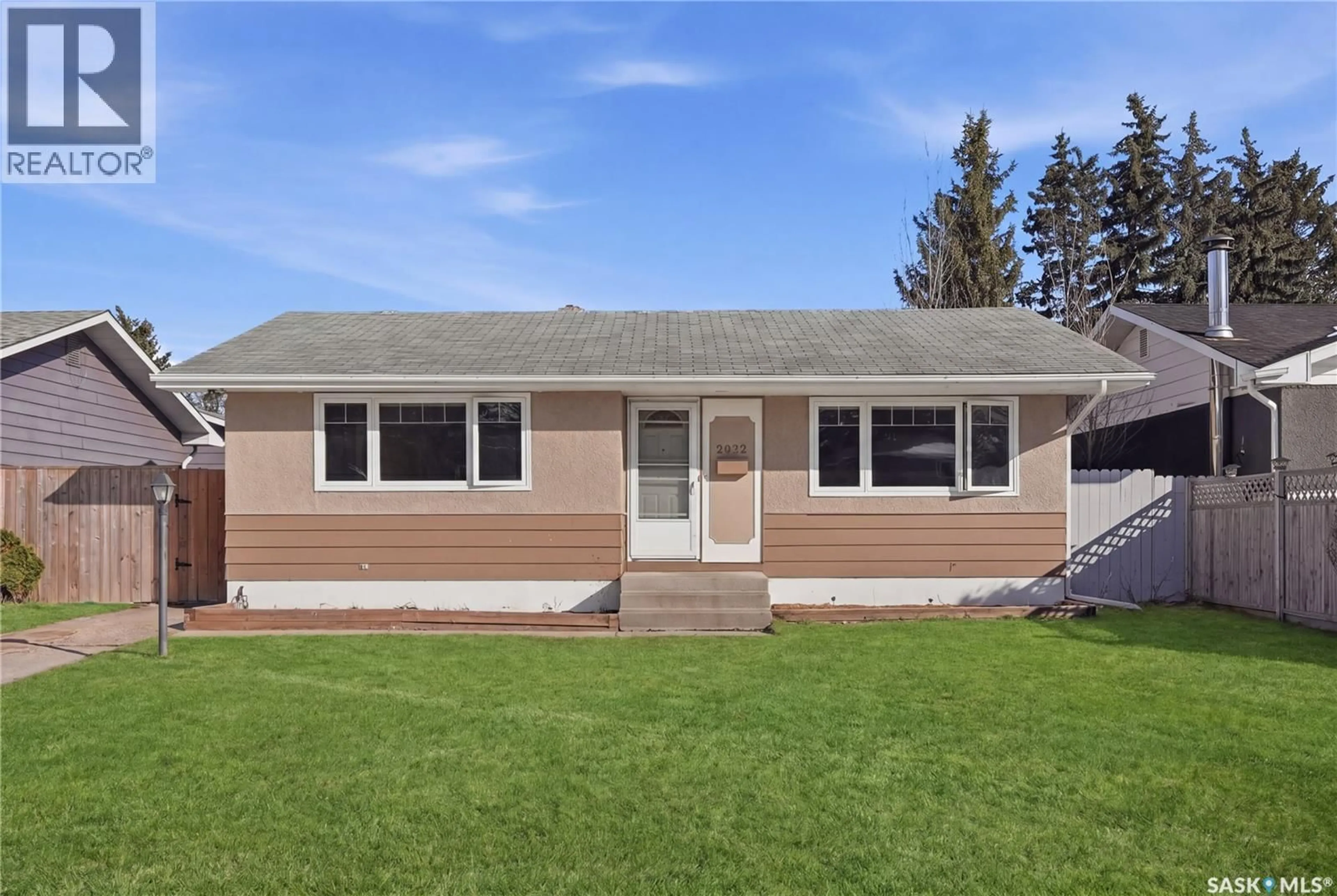 Home with vinyl exterior material, street for 2022 EASTHILL, Saskatoon Saskatchewan S7J3C7