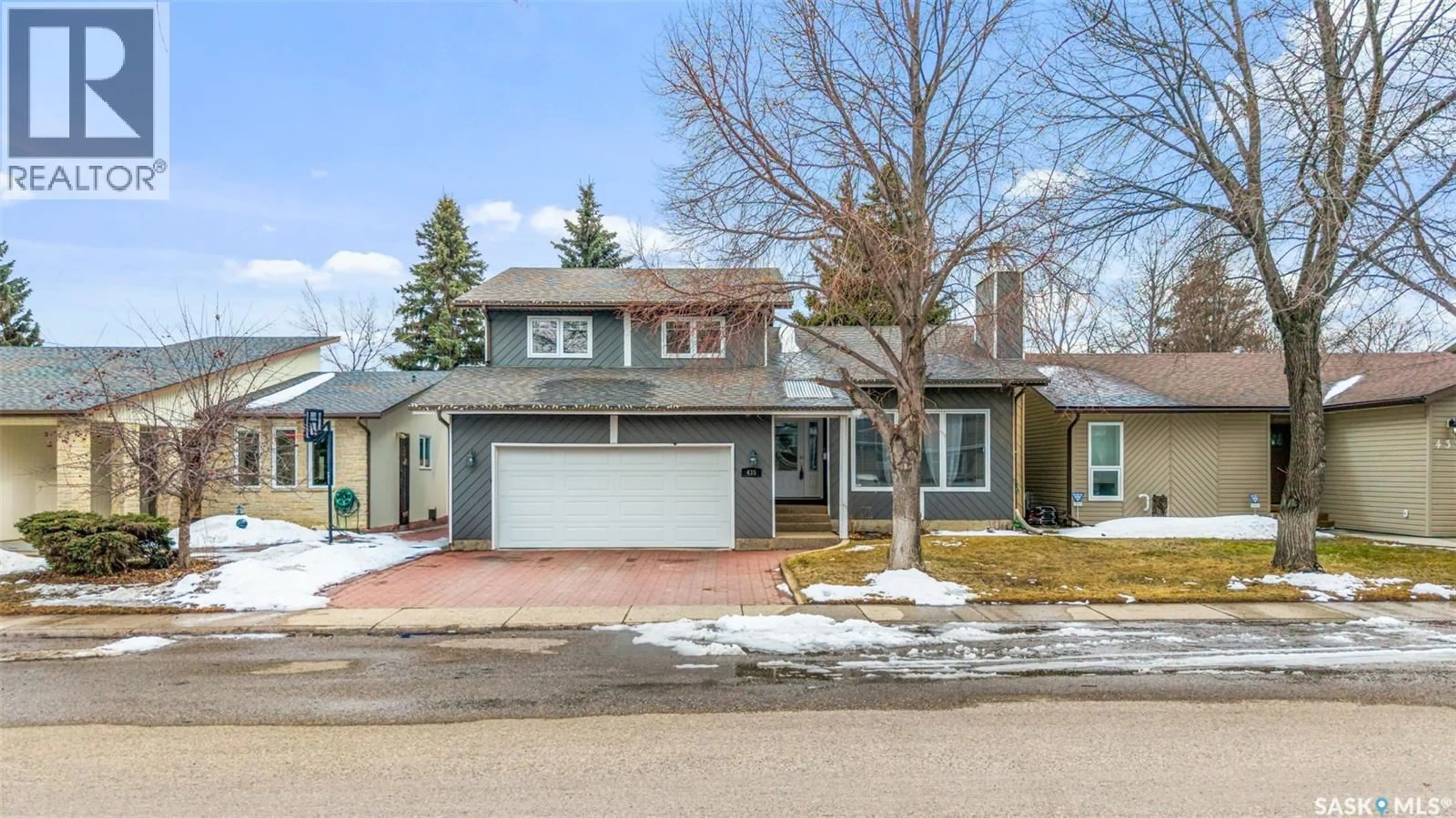 Home with brick exterior material, street for 435 CHRISTOPHER ROAD, Saskatoon Saskatchewan S7J3S1
