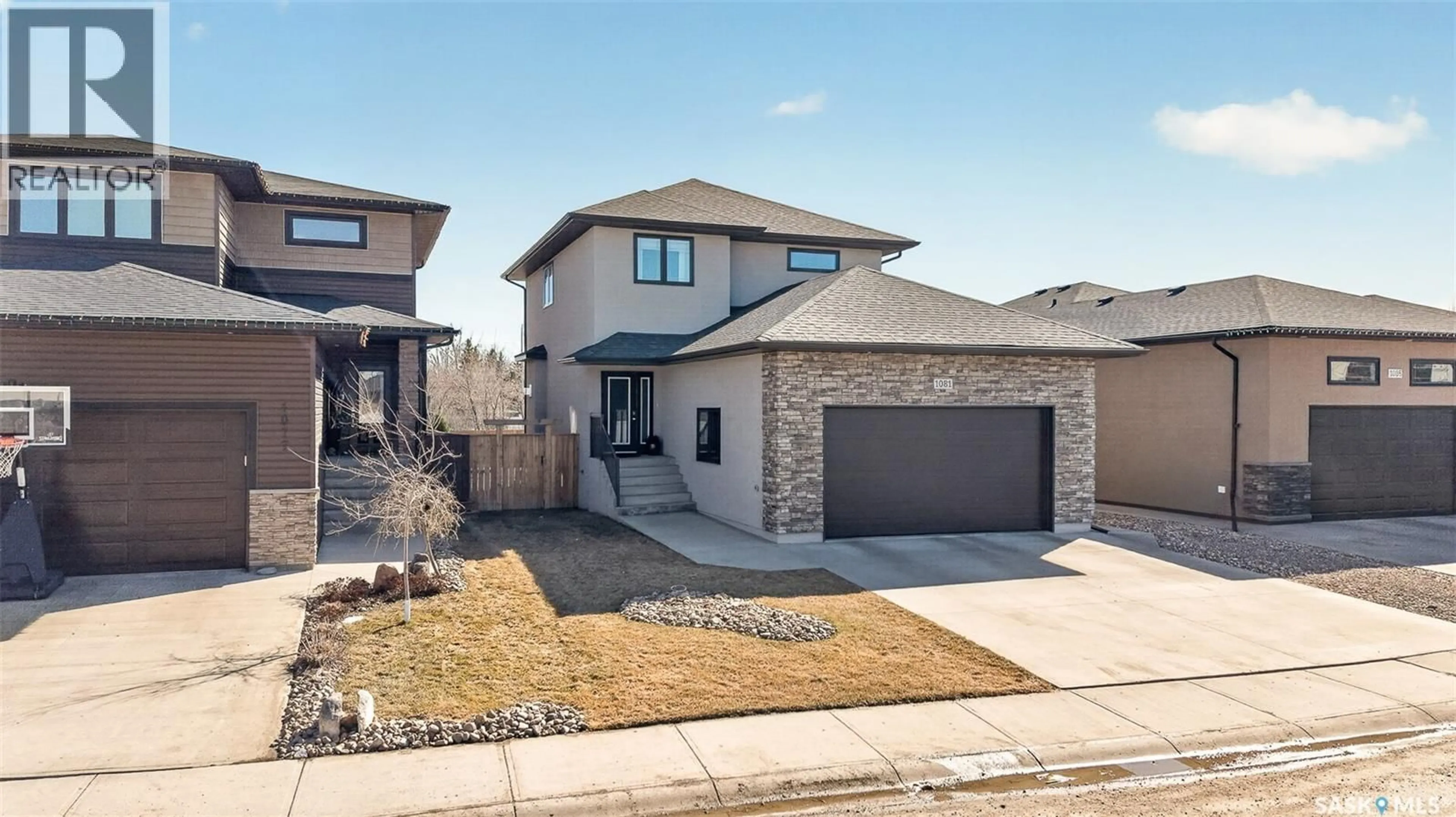 Home with brick exterior material, street for 1081 MAPLEWOOD DRIVE, Moose Jaw Saskatchewan S6J0B6