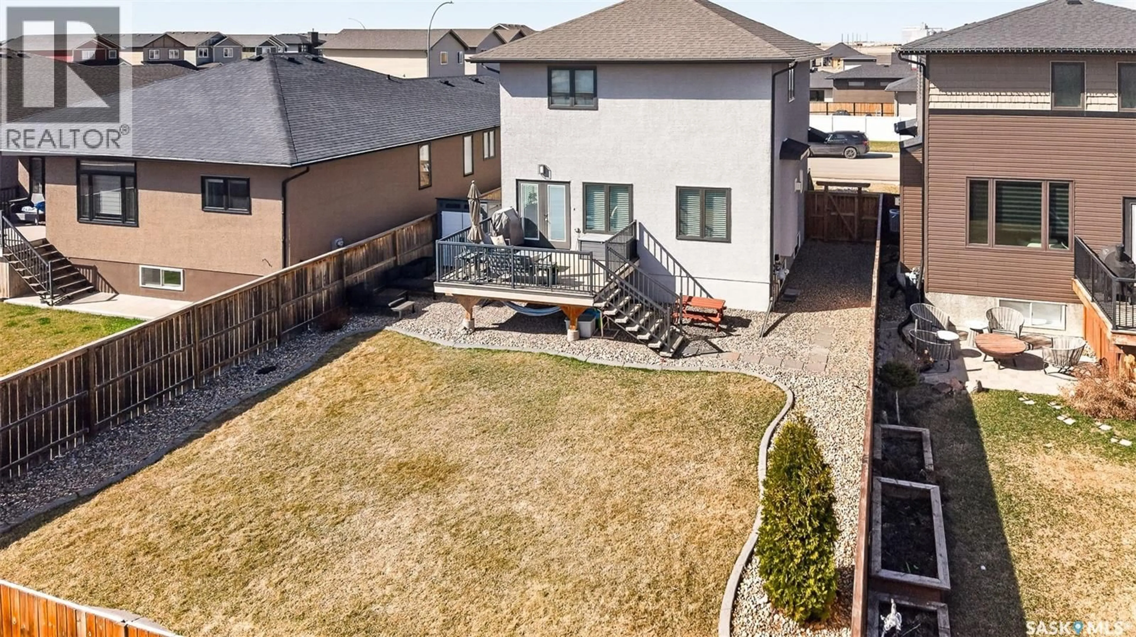 A pic from outside/outdoor area/front of a property/back of a property/a pic from drone, street for 1081 MAPLEWOOD DRIVE, Moose Jaw Saskatchewan S6J0B6