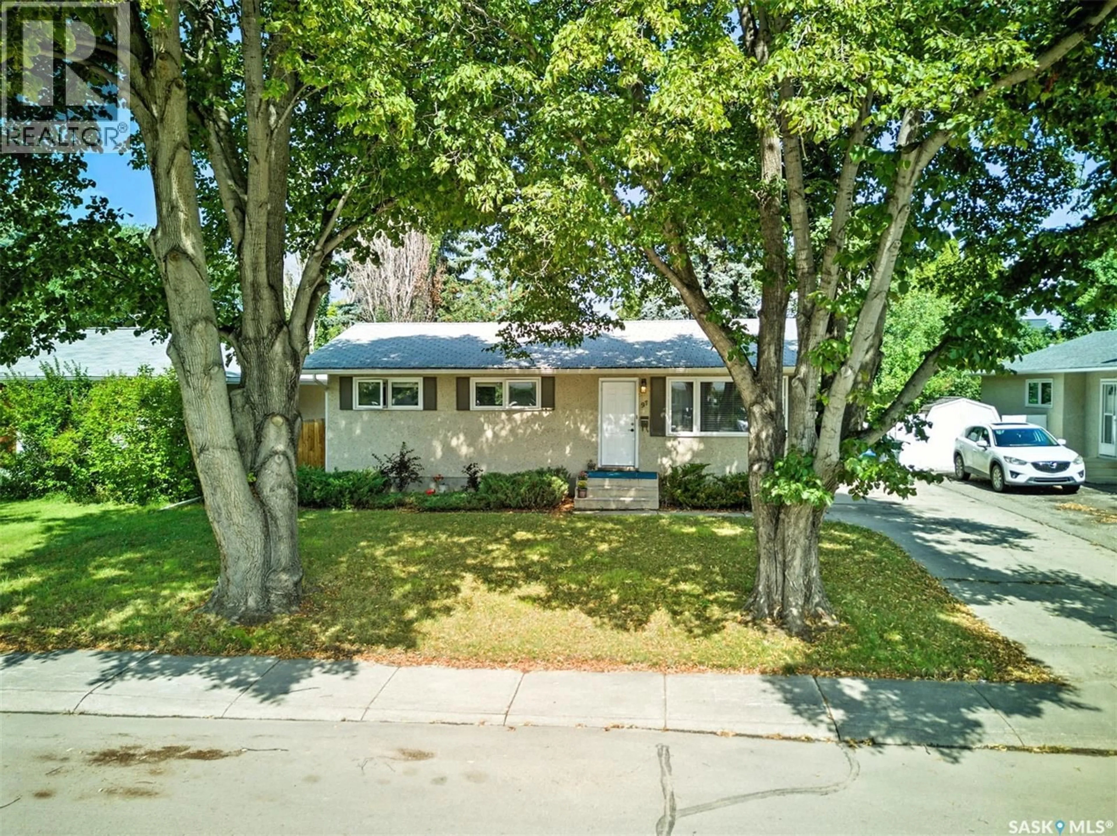 A pic from outside/outdoor area/front of a property/back of a property/a pic from drone, street for 97 MAXWELL CRESCENT, Saskatoon Saskatchewan S7L3Y4