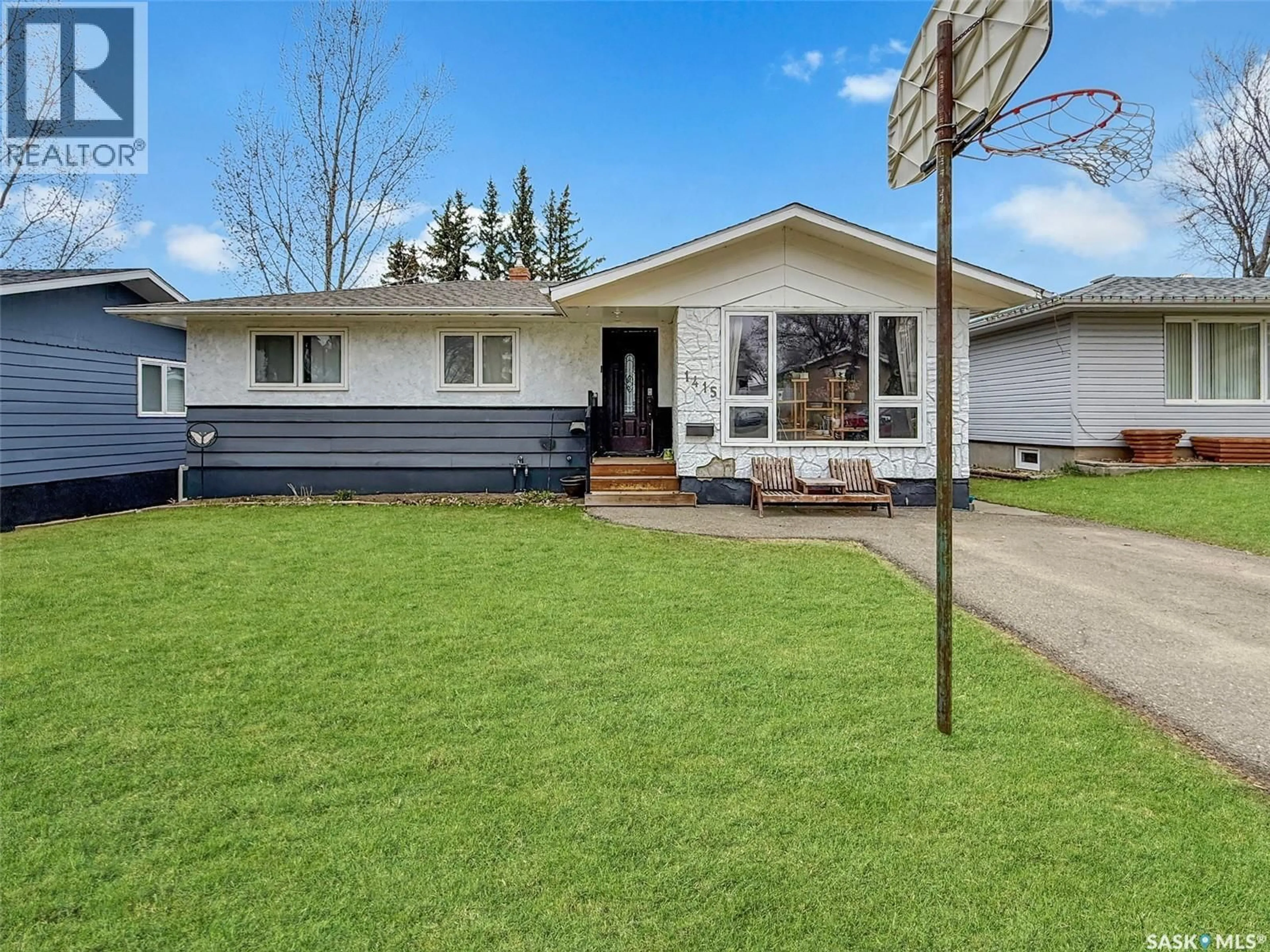 Home with vinyl exterior material, street for 1415 ASHLEY DRIVE, Swift Current Saskatchewan S9H1N6
