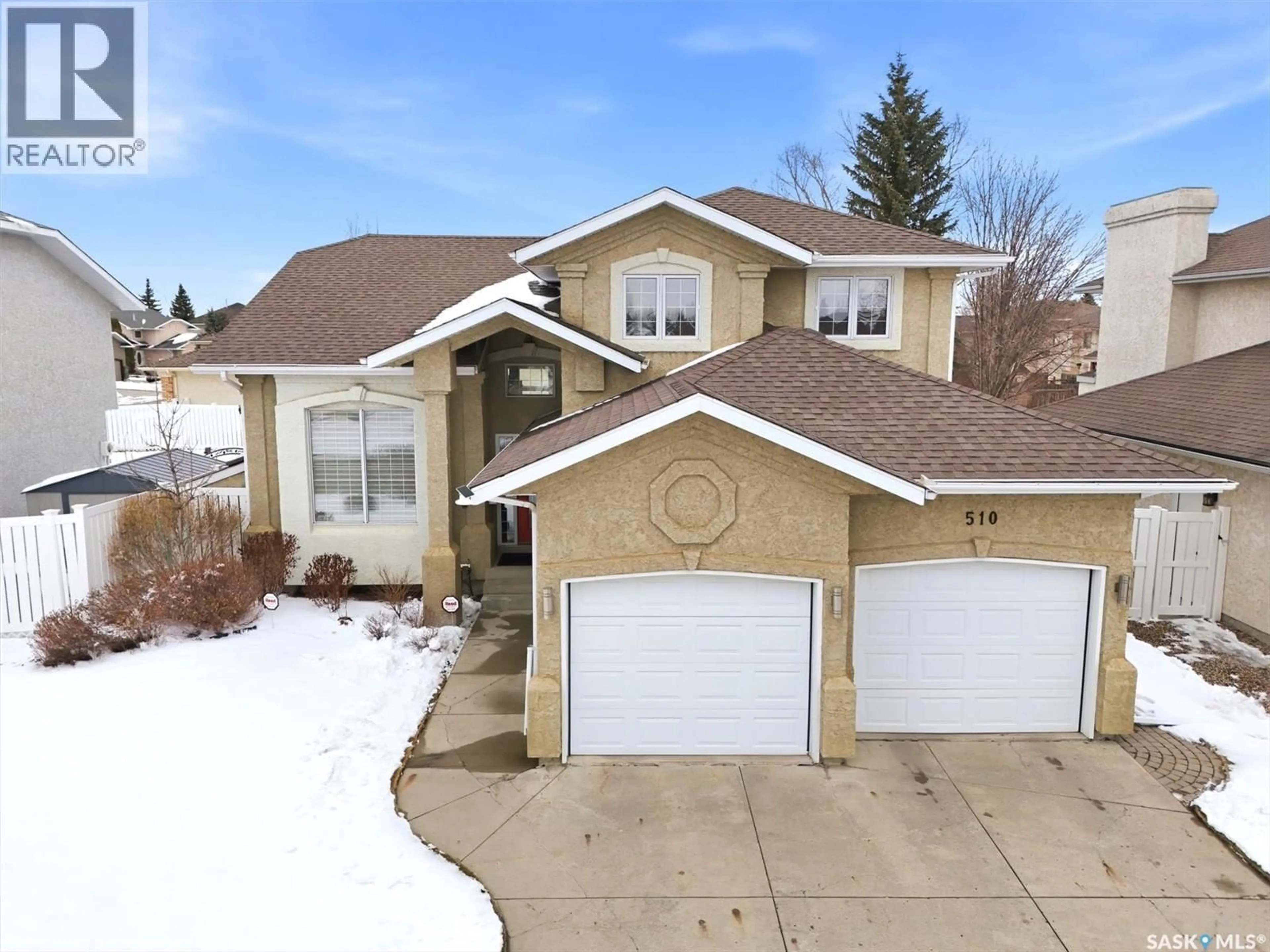 Home with vinyl exterior material, street for 510 EASTMAN COVE, Saskatoon Saskatchewan S7N4K9