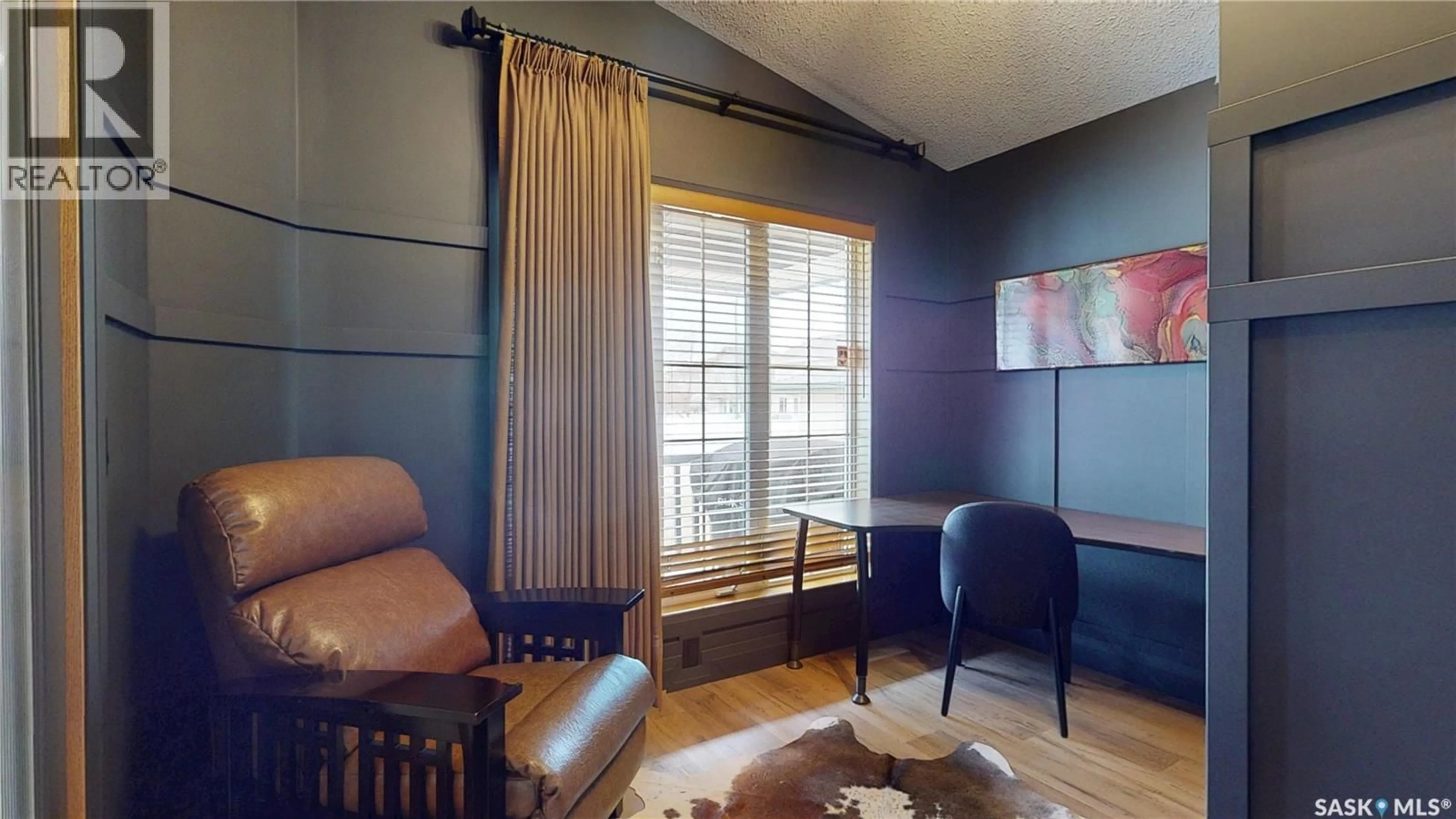 Living room with furniture, wood/laminate floor for 1650 ROUSSEAU CRESCENT, Regina Saskatchewan S4X4L9