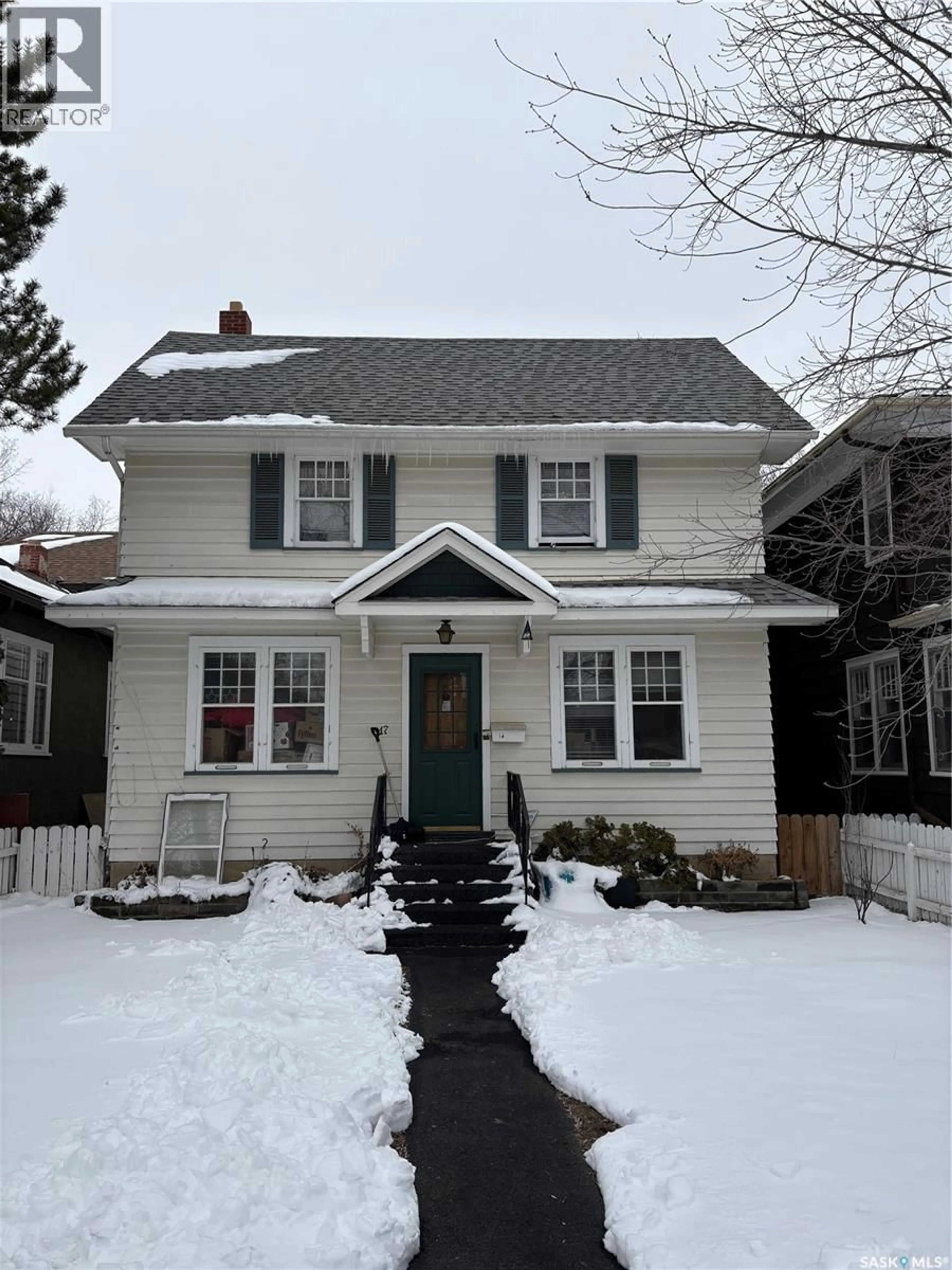 Home with vinyl exterior material, street for 617 CLARENCE AVENUE, Saskatoon Saskatchewan S7H2E1