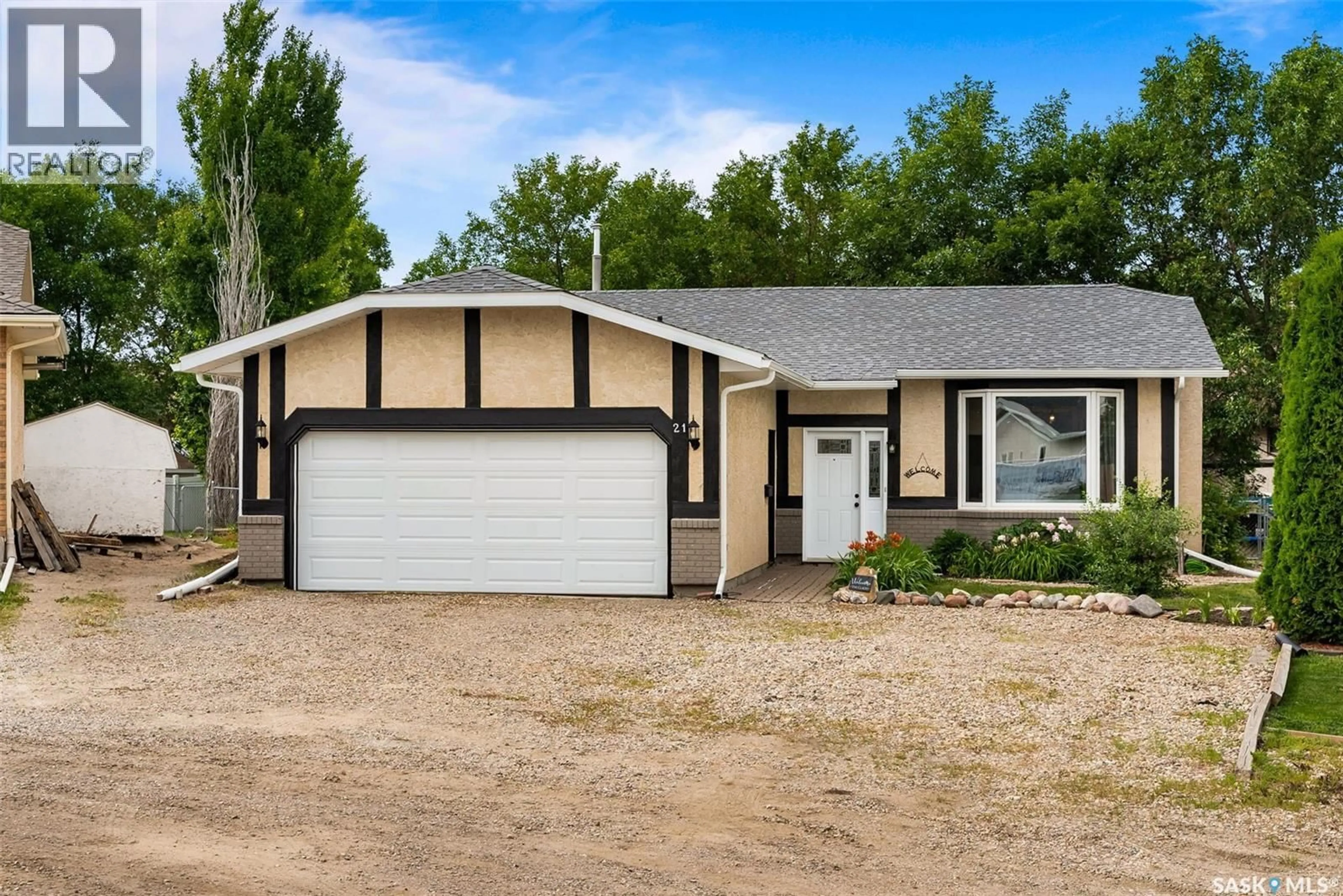 Home with vinyl exterior material, street for 21 RIDER BAY, Grand Coulee Saskatchewan S4M0A3