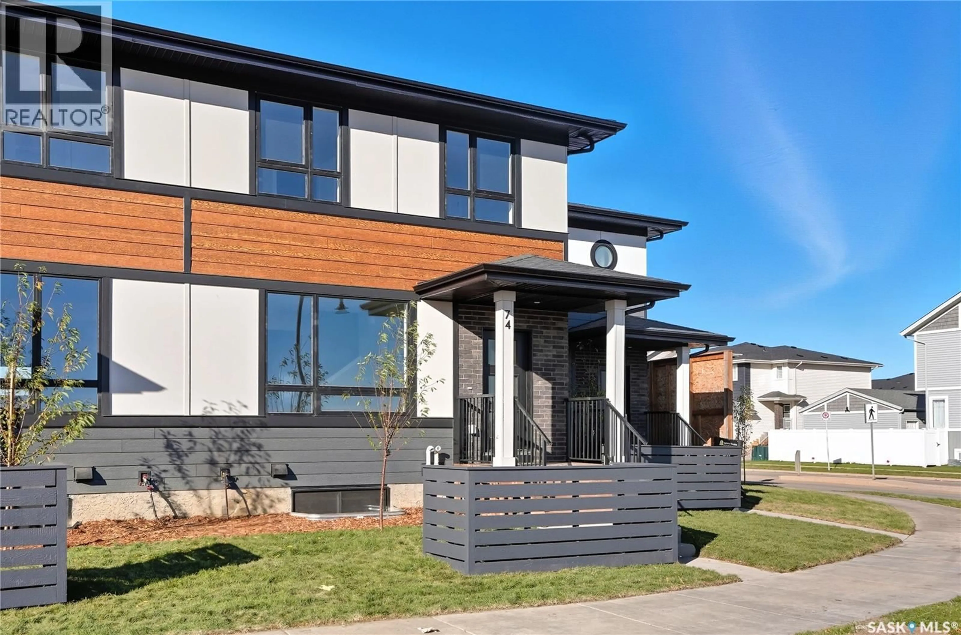 Home with brick exterior material, street for 22 TASKAMANWA TERRACE, Saskatoon Saskatchewan S7V1Z7