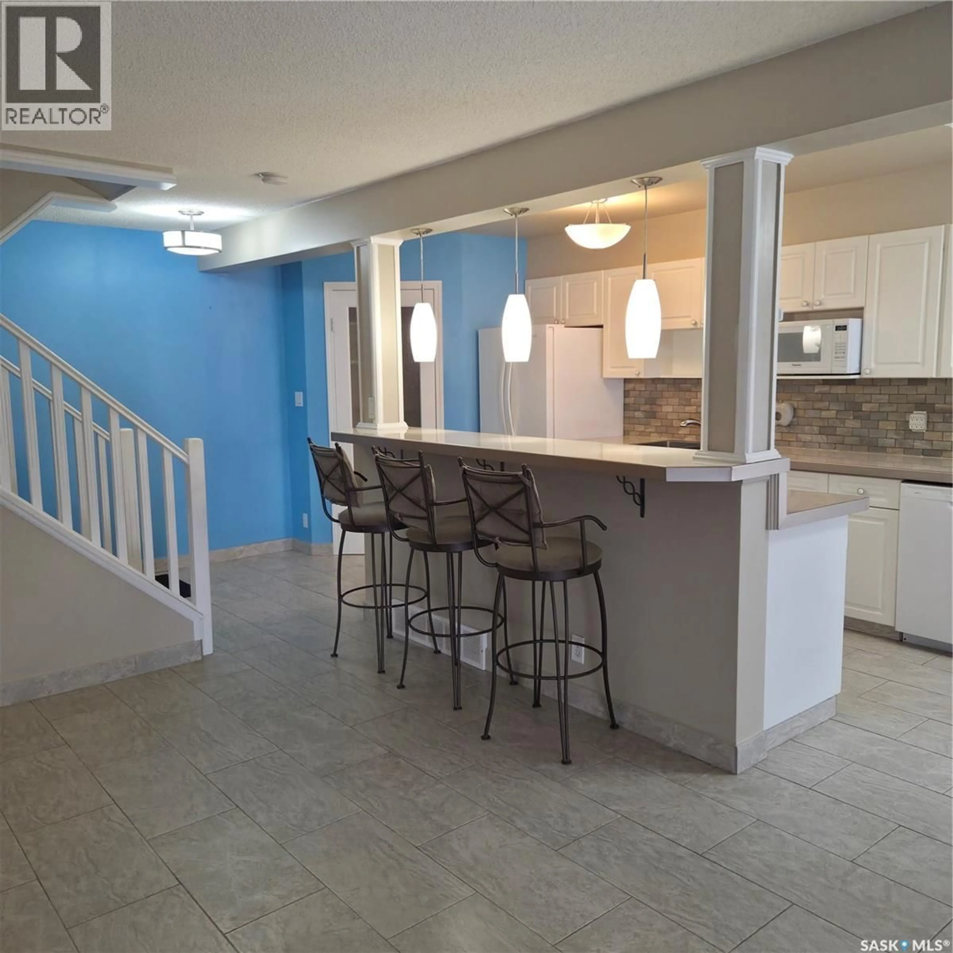Open concept kitchen, ceramic/tile floor for 17 1292 GORDON ROAD, Moose Jaw Saskatchewan S6H3E5