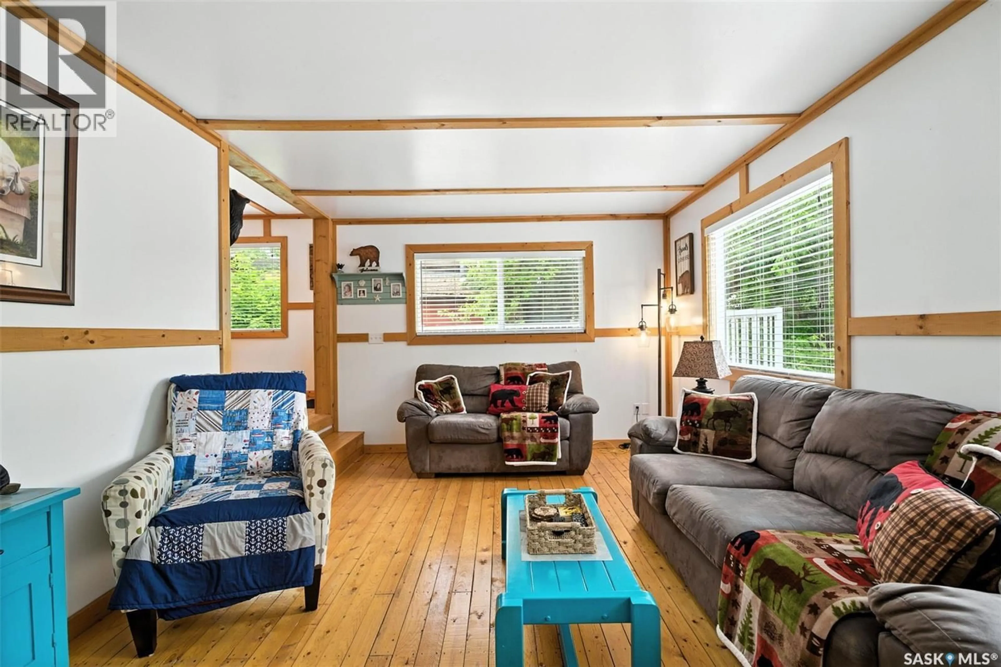 Living room with furniture, wood/laminate floor for 3B STONEY LAKE ROAD, Humboldt Rm No. 370 Saskatchewan S0K2A0