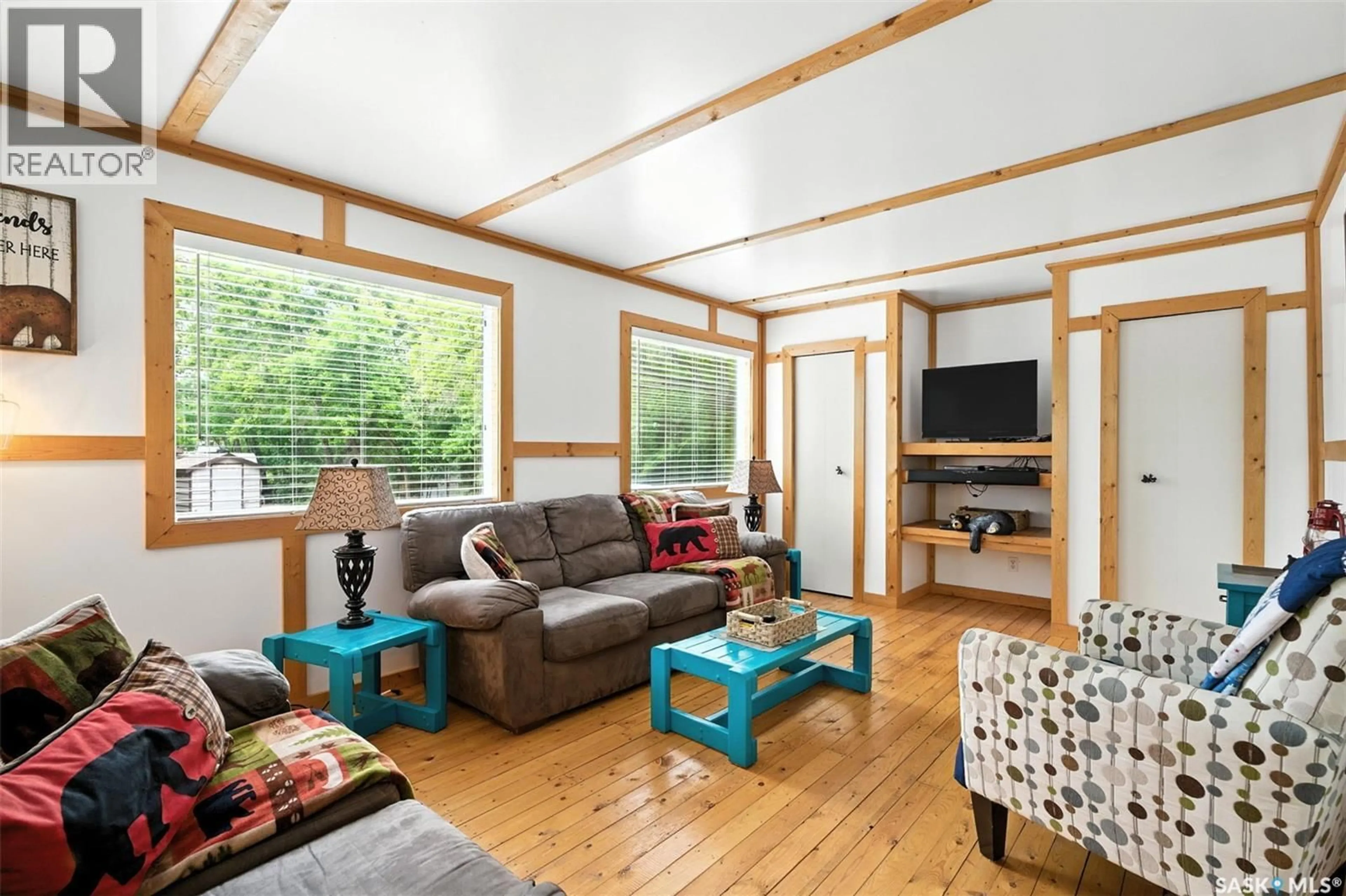 Living room with furniture, wood/laminate floor for 3B STONEY LAKE ROAD, Humboldt Rm No. 370 Saskatchewan S0K2A0