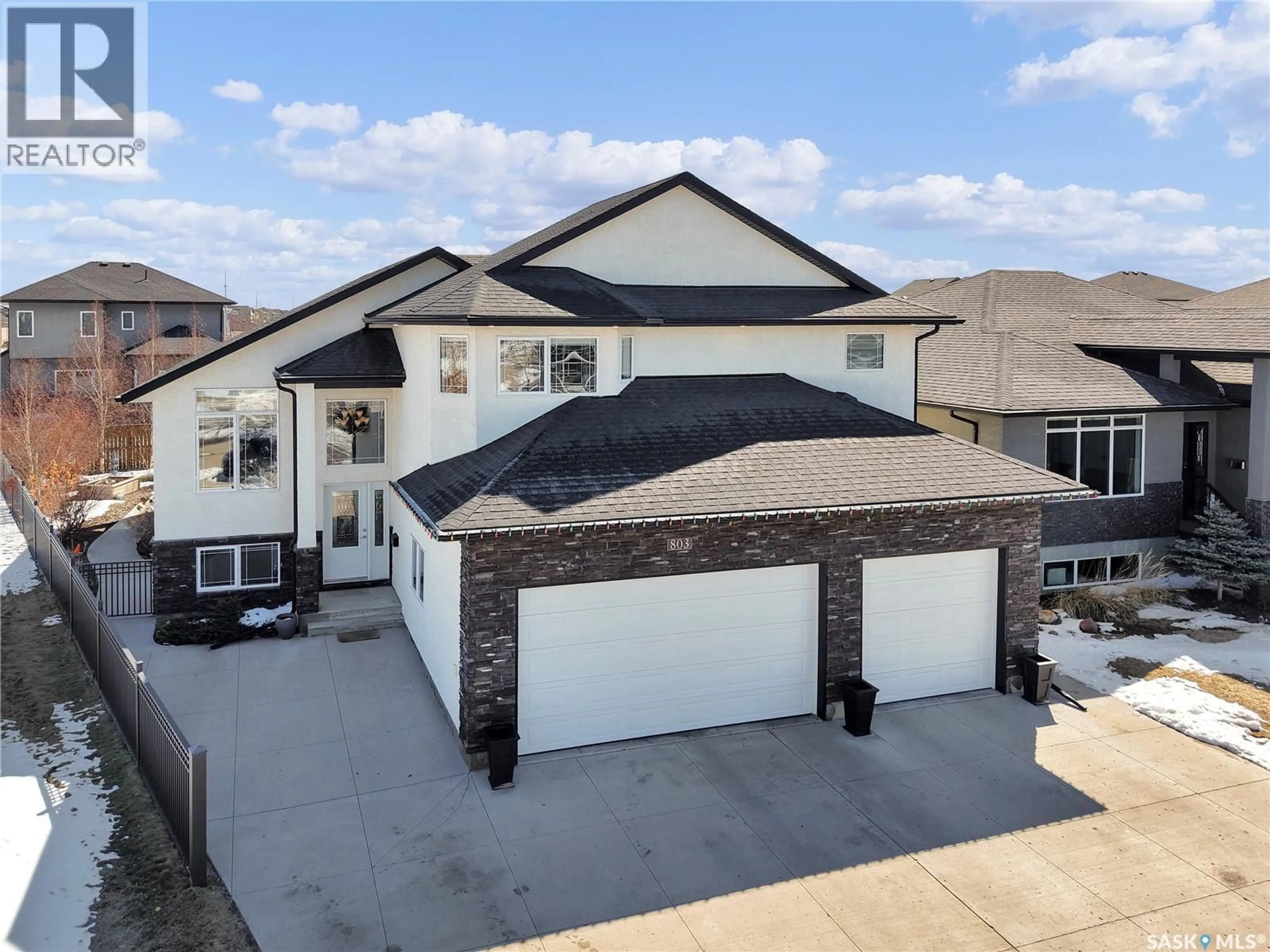 A pic from outside/outdoor area/front of a property/back of a property/a pic from drone, street for 803 SALLOUM CRESCENT, Saskatoon Saskatchewan S7W0N3
