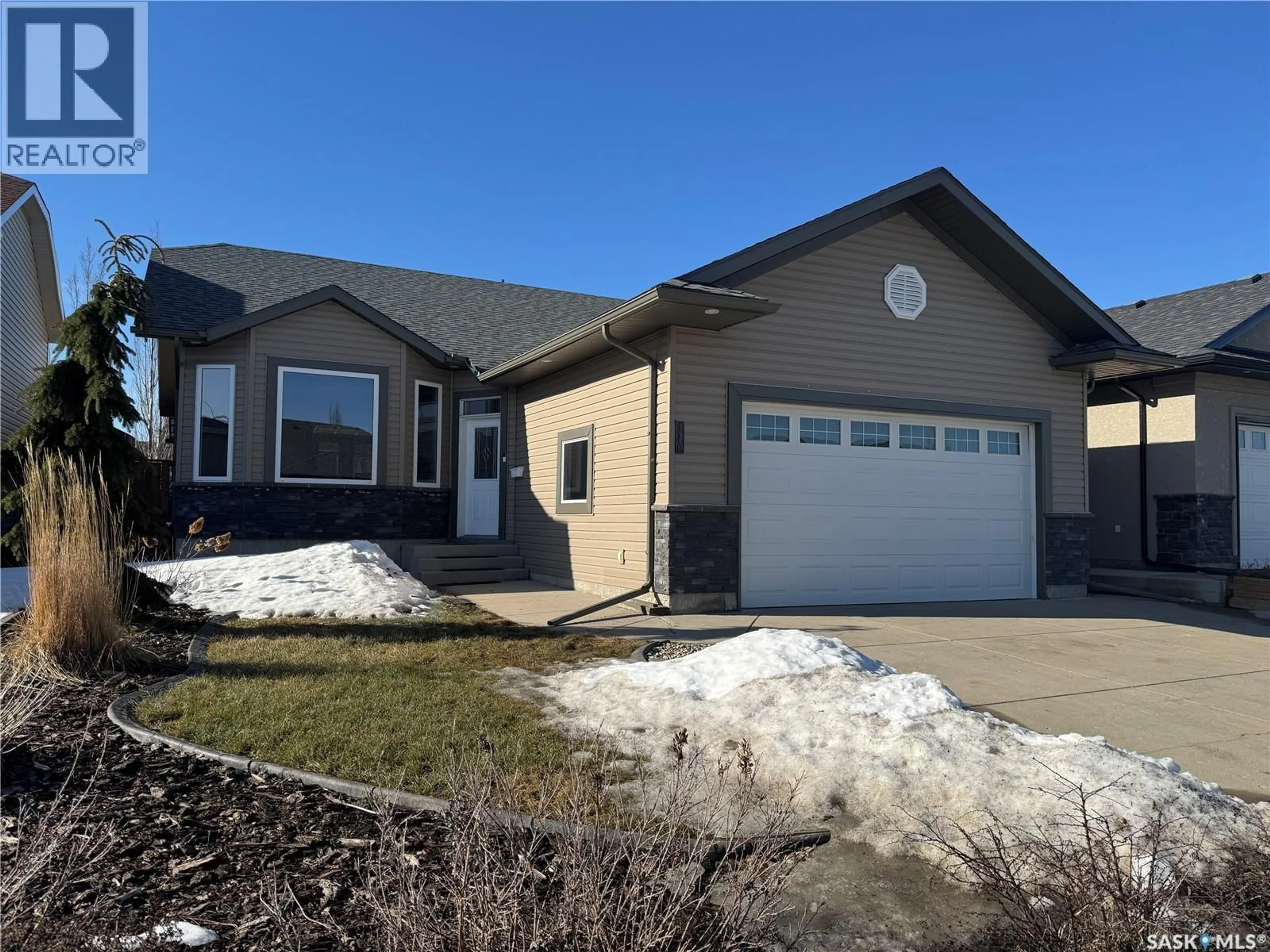 Home with vinyl exterior material, street for 1118 PATON LANE, Saskatoon Saskatchewan S7W0C1