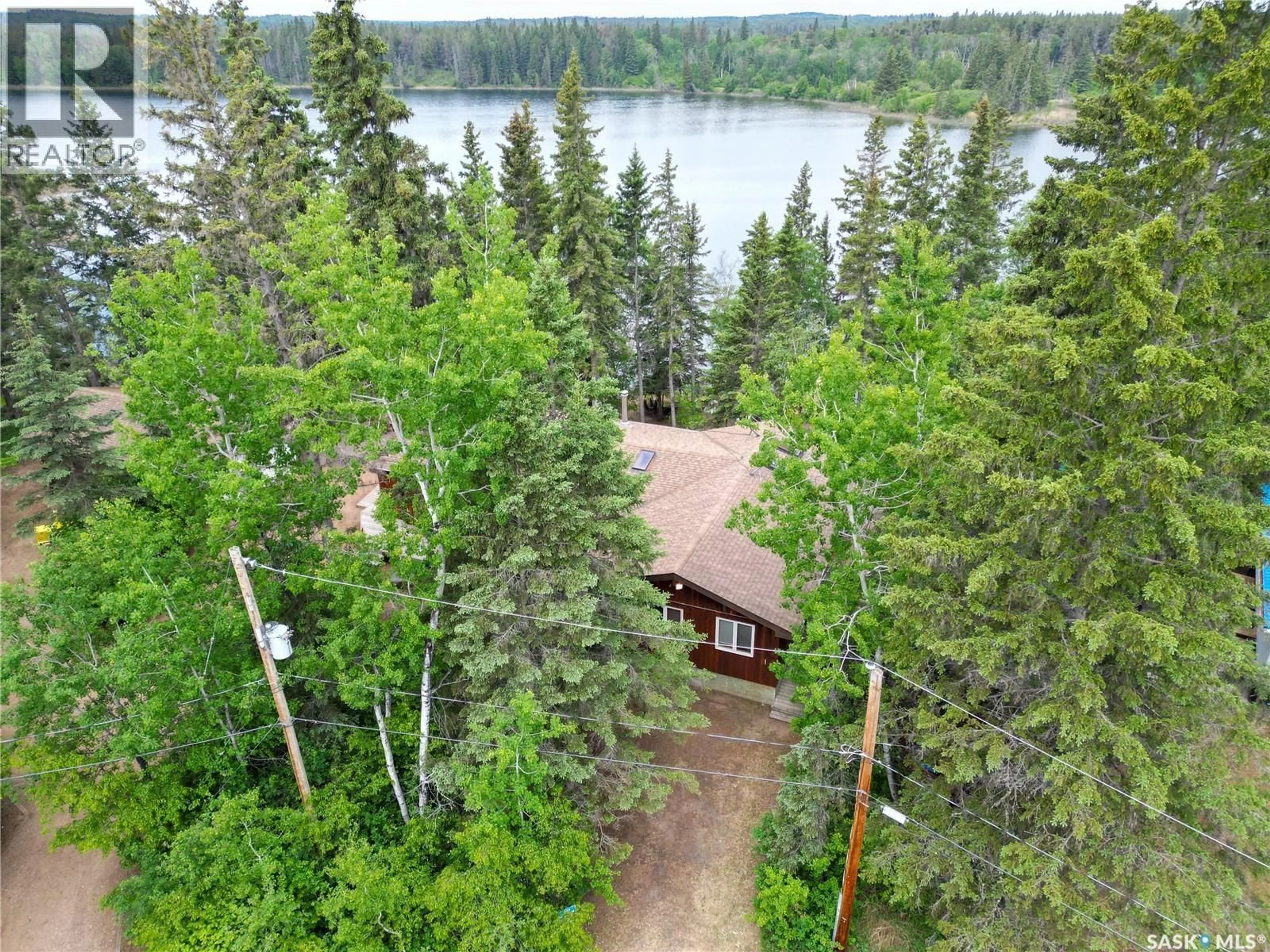 A pic from outside/outdoor area/front of a property/back of a property/a pic from drone, forest/trees view for 224 KINGFISHER DRIVE, Canwood Rm No. 494 Saskatchewan S0J0K0