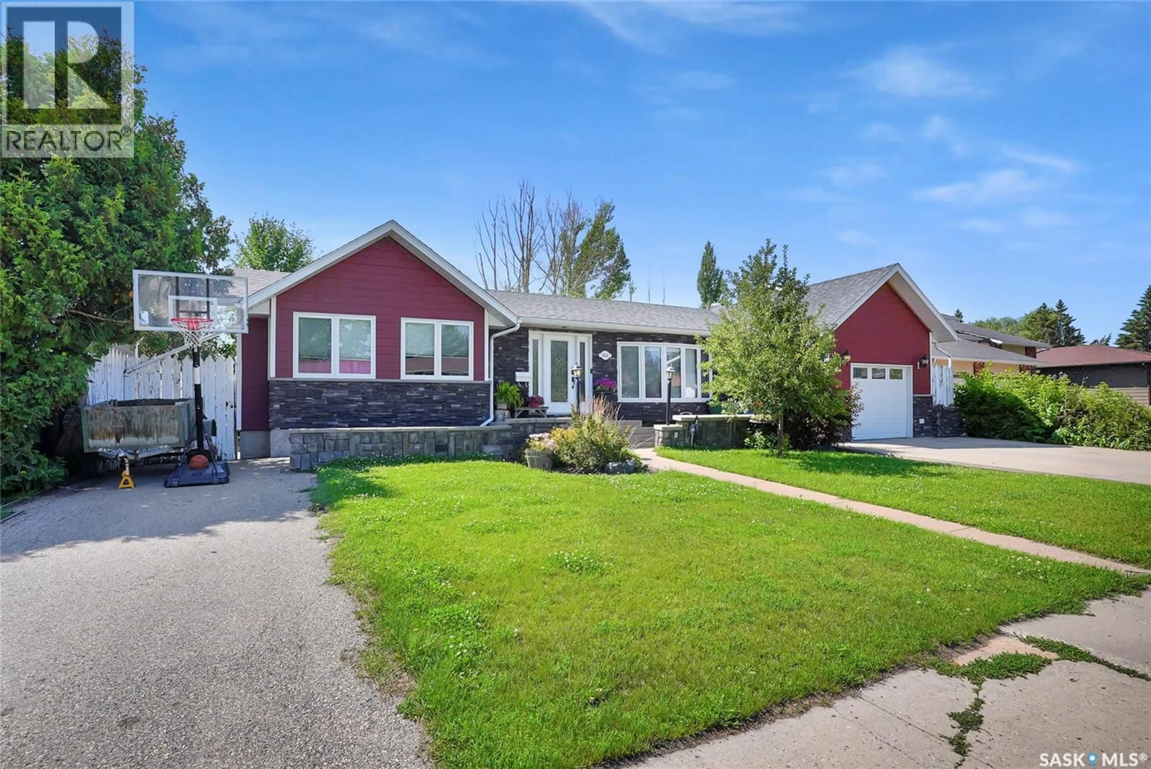 Home with vinyl exterior material, street for 1614 11TH AVENUE, Moose Jaw Saskatchewan S6H6W9