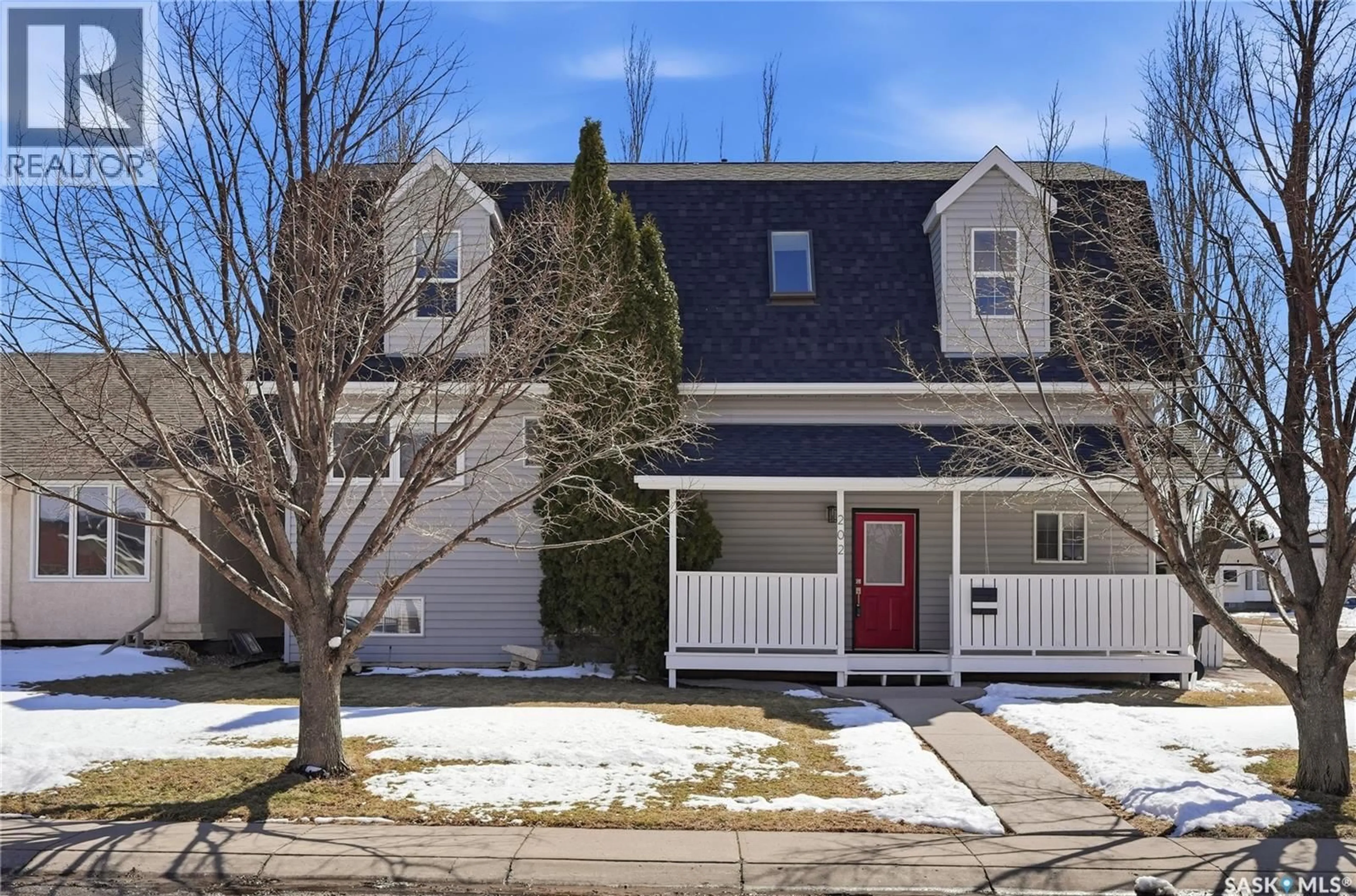 Home with vinyl exterior material, street for 202 COBEN CRESCENT, Saskatoon Saskatchewan S7S1B1